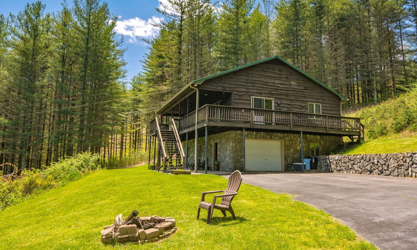 PRIVACY, ACREAGE, AND VIEWS!  What more can you ask for?  Put your own touches  and personality in this rustic NC Mountain home with potential long range mountain views and over 15 acres to explore, hike or hunt.