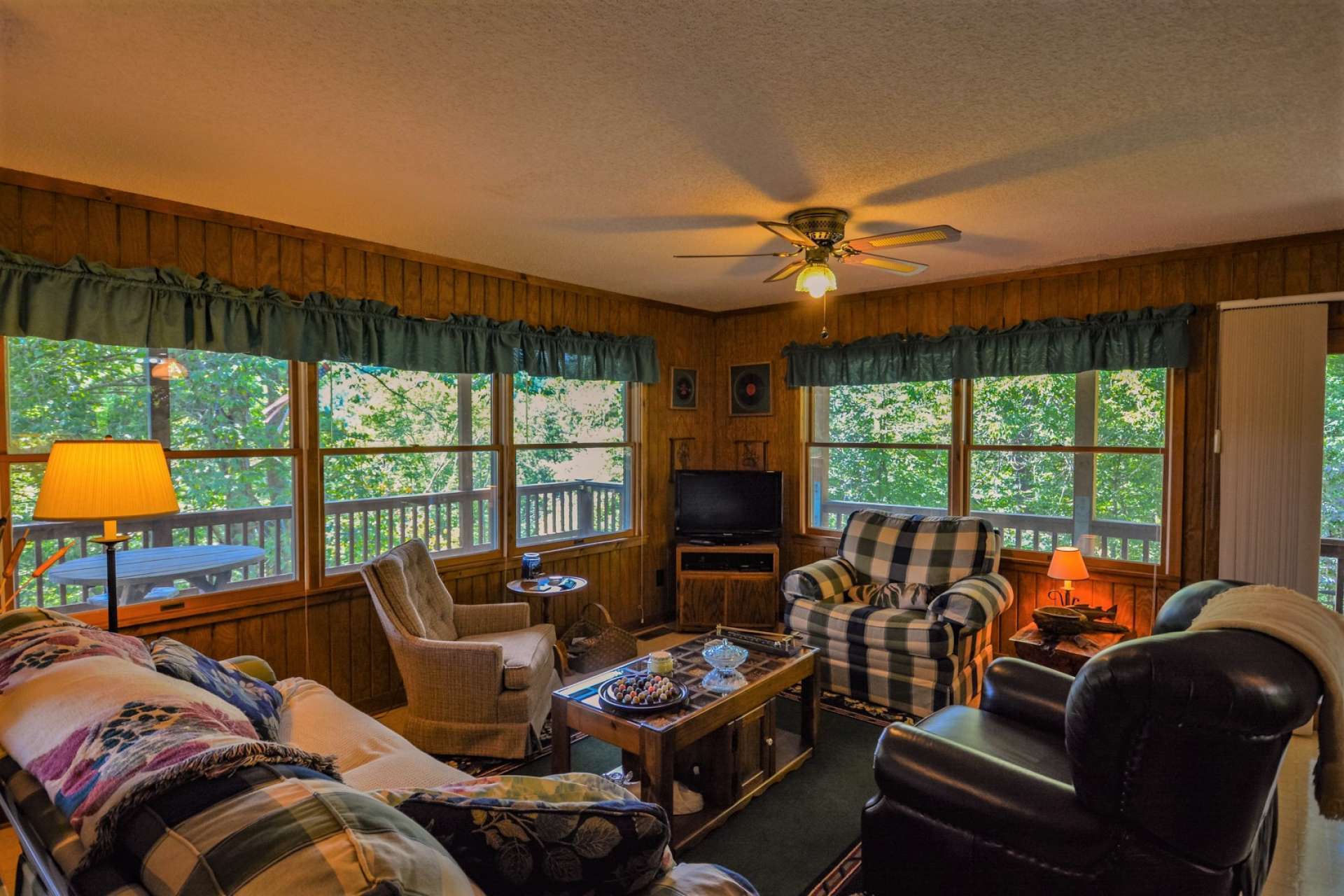 The living area provides lots of windows for natural light and allows you to enjoy the outdoor scenery through all four seasons in the NC High Country.