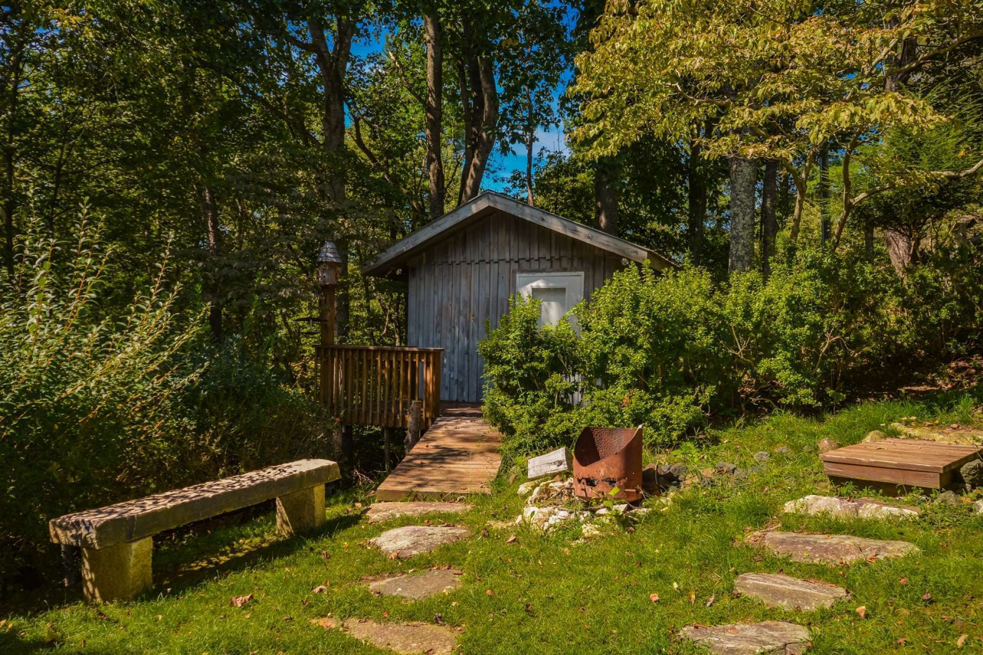 This outbuilding provides storage space for outdoor lawn and garden equipment, as well as your mountain and river toys.