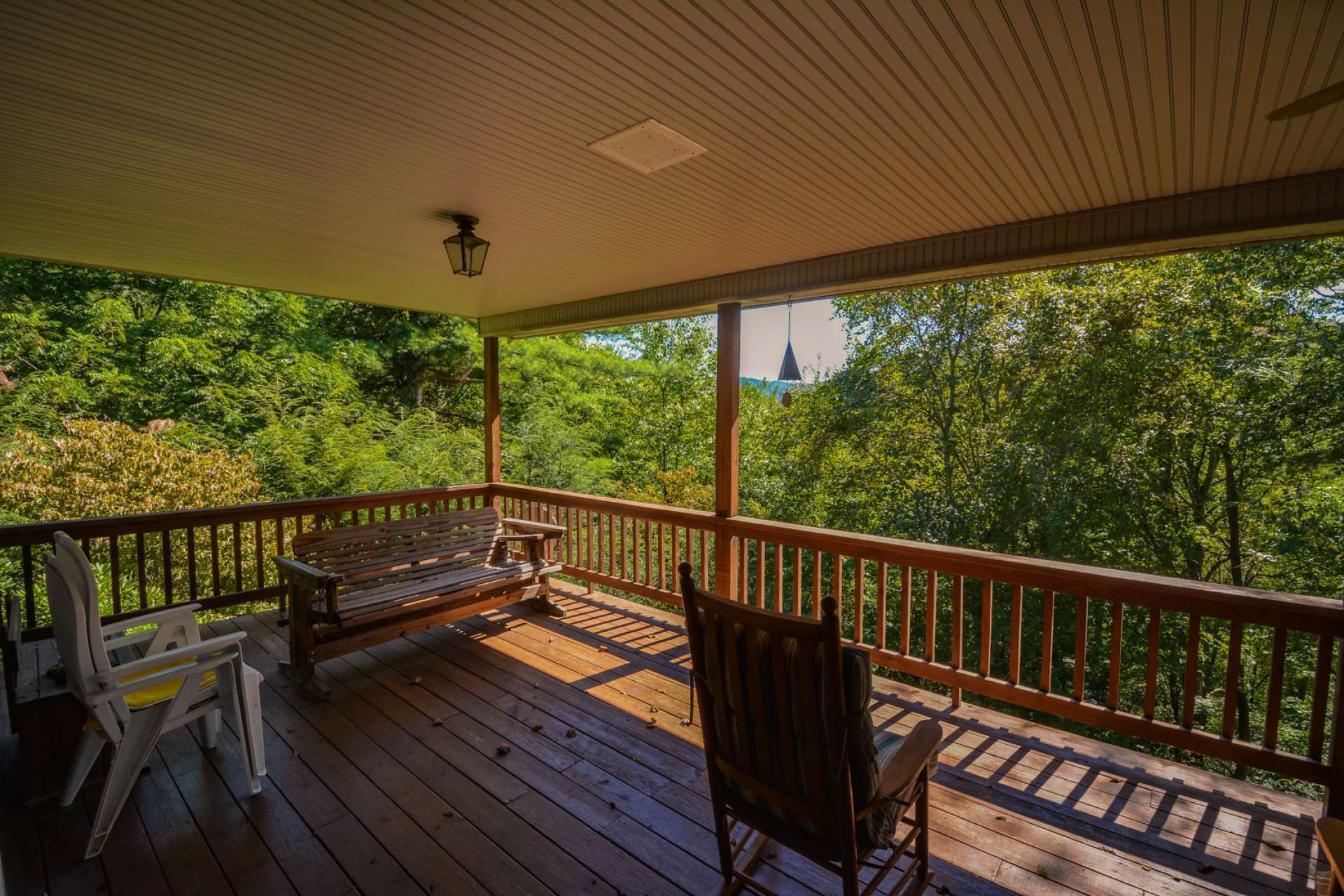 A full length covered front porch is ideal for outdoor entertaining or just relaxing with the sounds of Nature surrounding you.