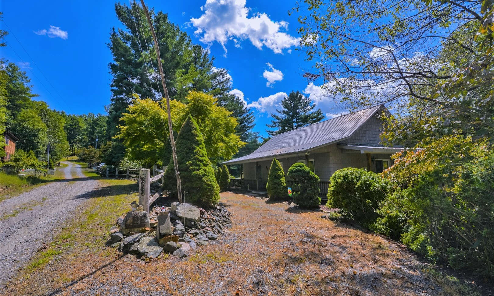 This sweet 2-bedroom, 2-bath mountain style rancher is hidden among a tree-lined 1.8 acre setting on a hilltop just off of Turkey Hill South  in the Bent River Estates community, and offers seasonal views.