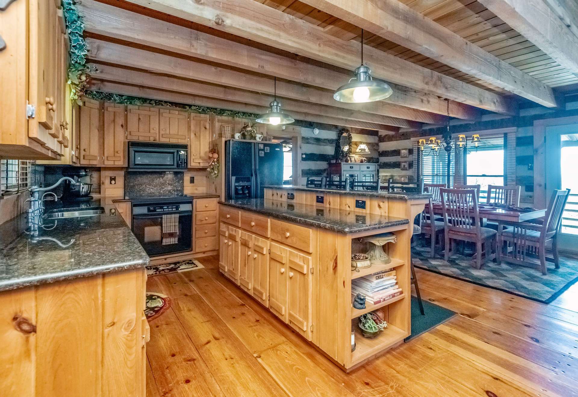 Modern kitchen with abundant cabinet space and granite countertops that enhance the home's features.