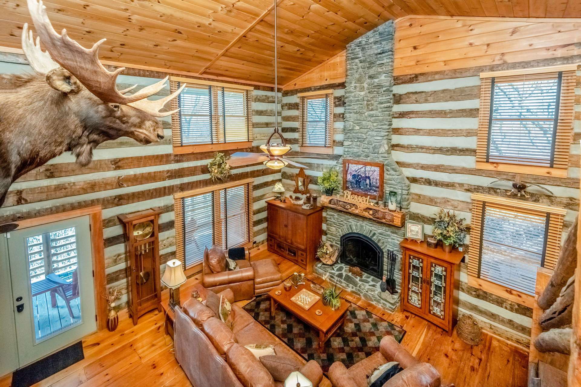 A Floor to ceiling flagstone wood-burning fireplace will keep you warm on those chilly winter nights while abundant windows fill the home with natural light.