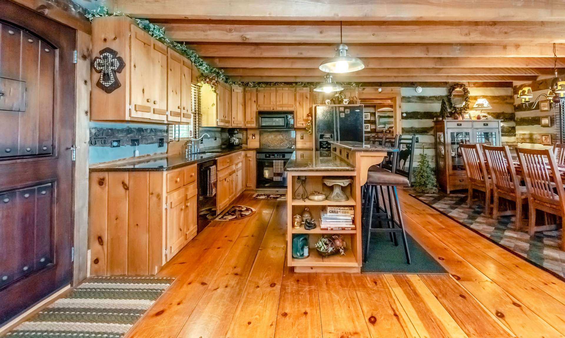 Wide plank wood floors run throughout the home.