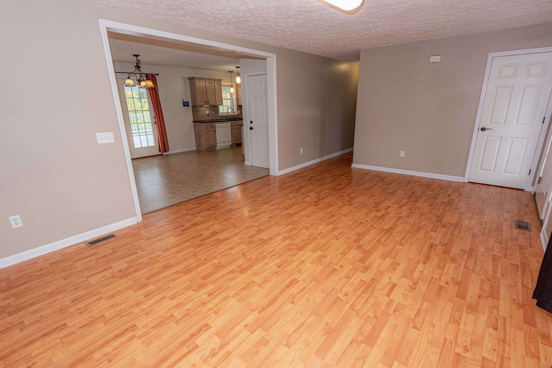 Living room area is spacious and offers a coat closet by the front door.