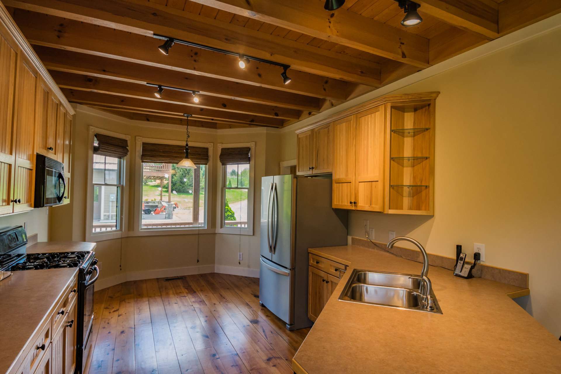 Enjoy breakfast with views of the outdoors through all four seasons in the  cozy nook with lots of windows.