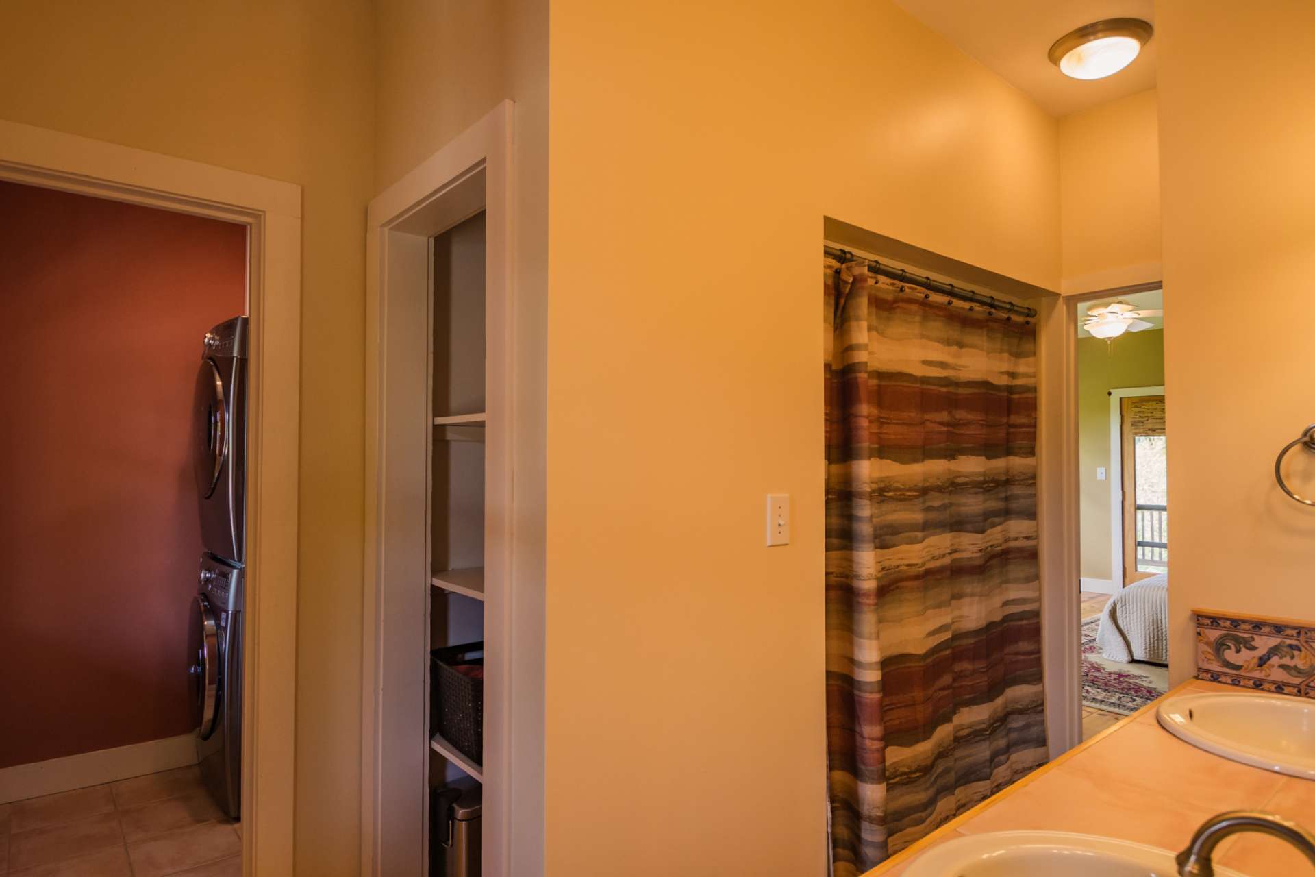 The large main level bath features a double vanity  and the laundry area completing the main level.
