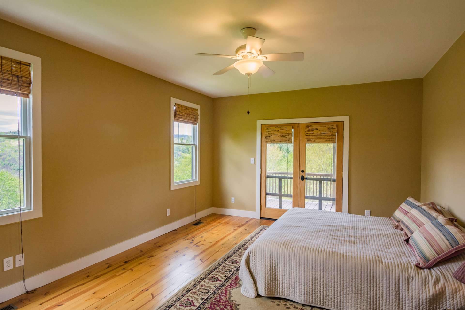 The main level offers a spacious master  bedroom with  walk-out access to the porch, and a shared bath.