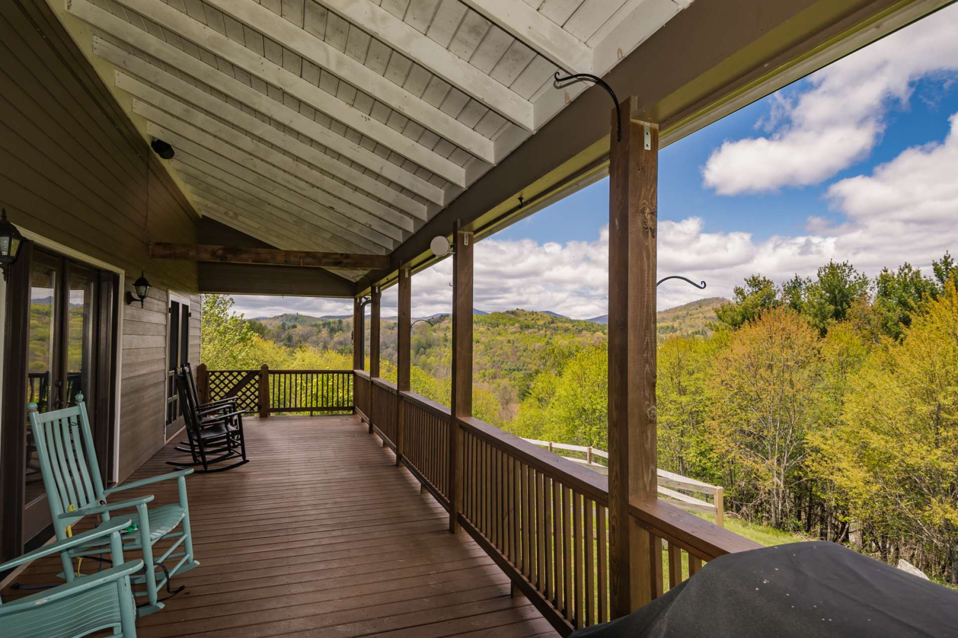 A full length covered deck offers a wonderful outdoor entertaining space. Or, simply enjoy the views while reading your favorite book.