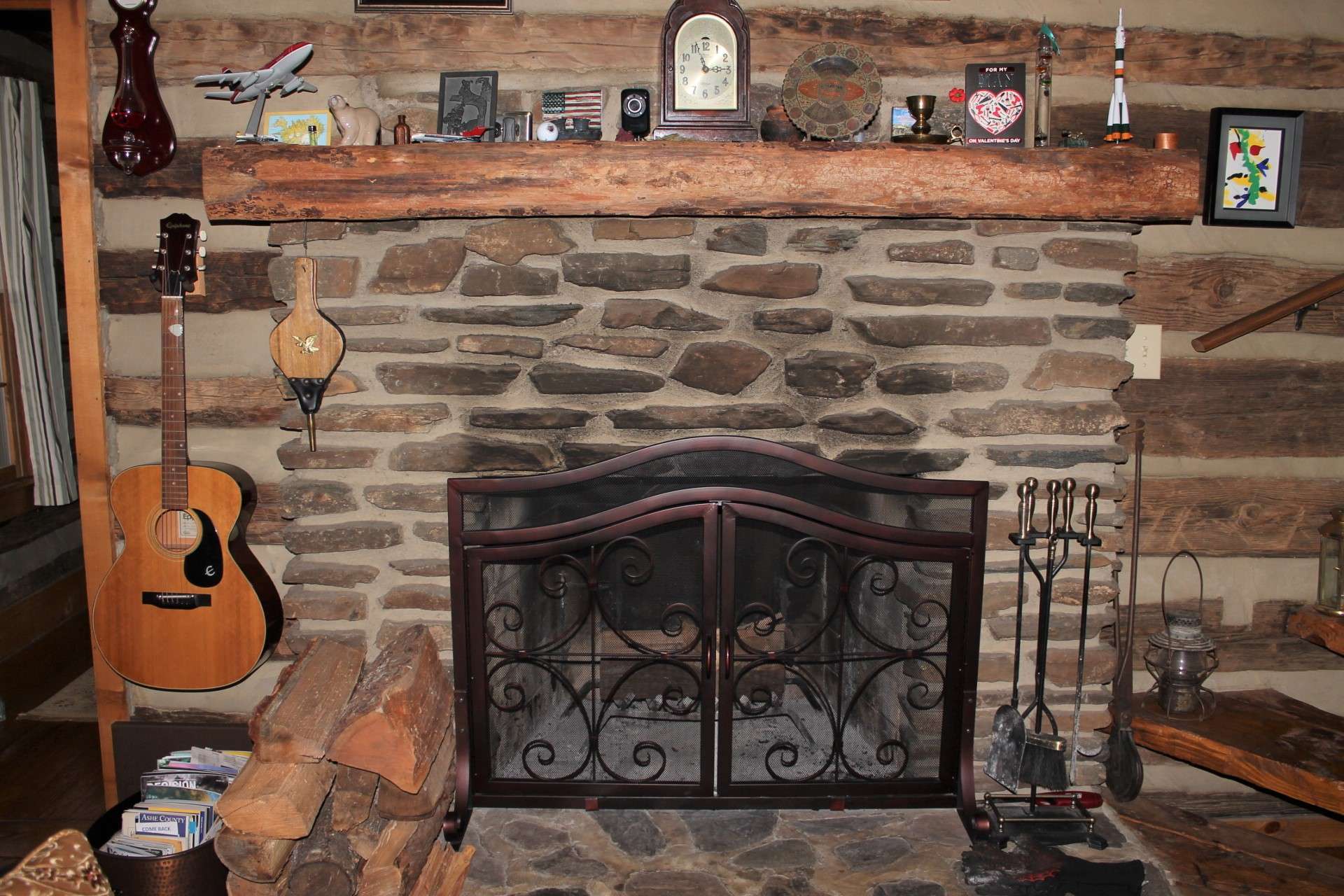 The native stone wood burning fireplace with rough hewn mantle provides a great way to display special keepsakes.