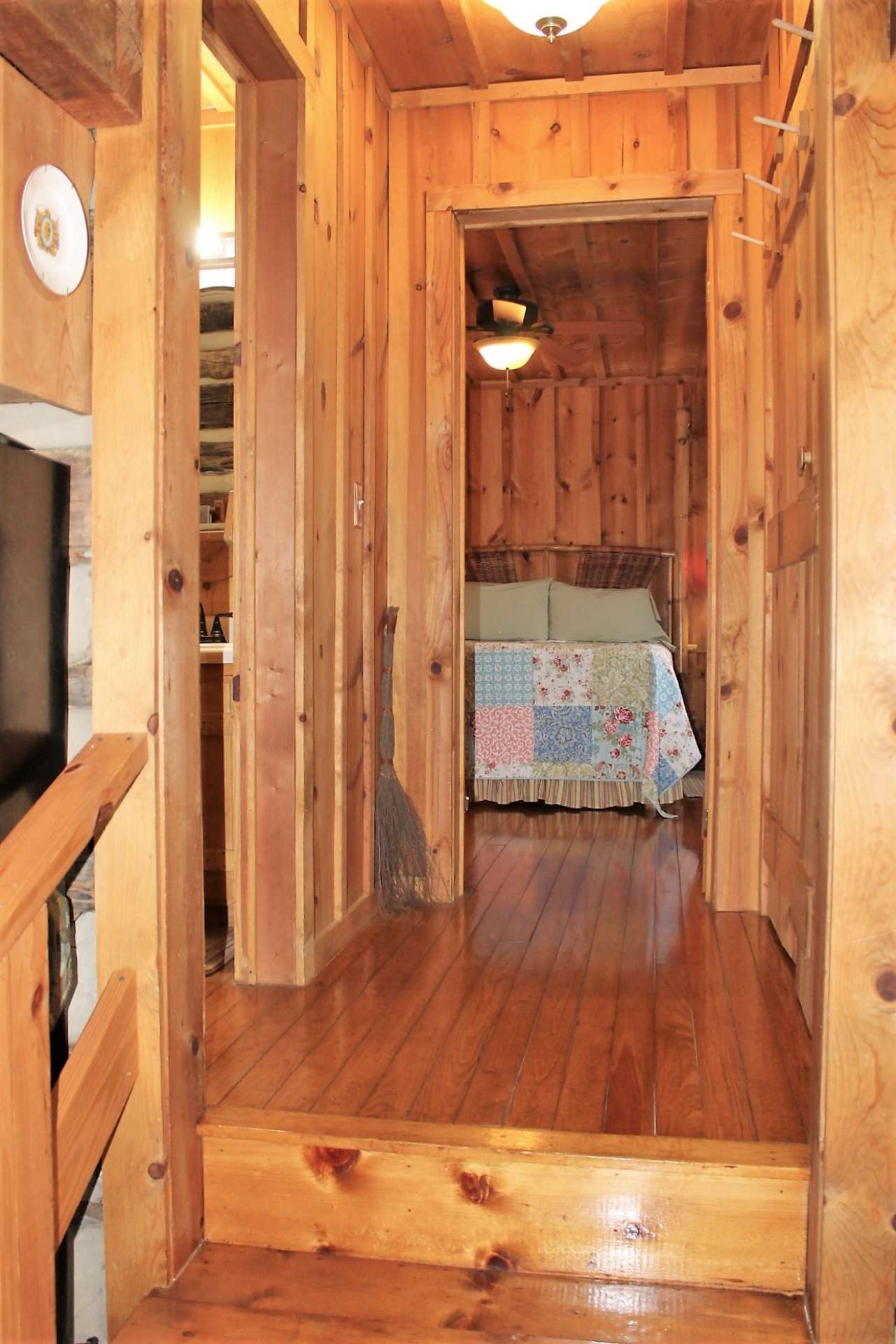 Three steps up to hallway - to the left is guest bath and right to laundry closet housing full size washer and dryer.