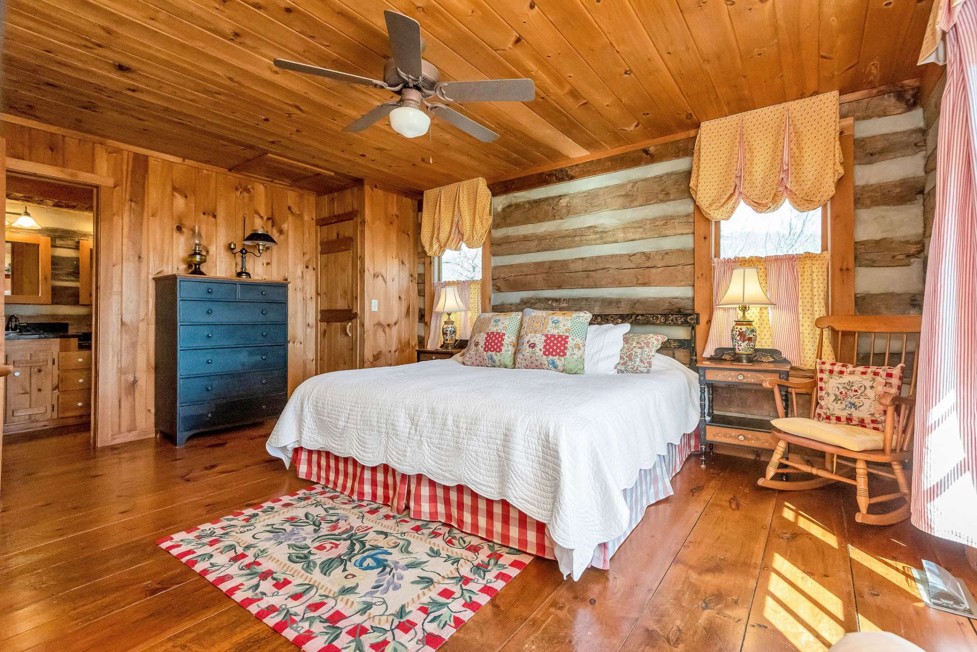 The main level bath is adjacent to the primary bedroom.