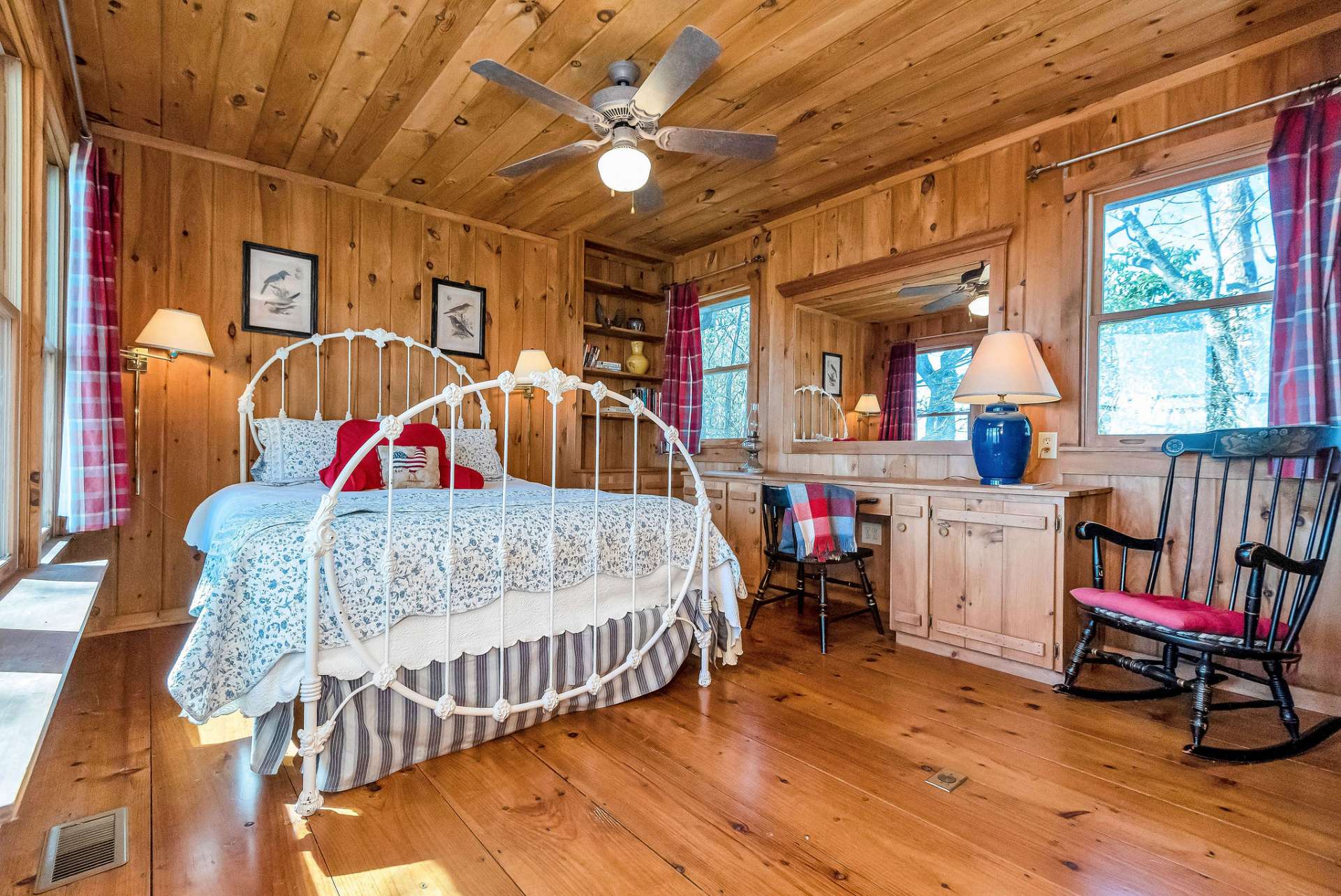 This guest room is adorned with built-ins and double closets.