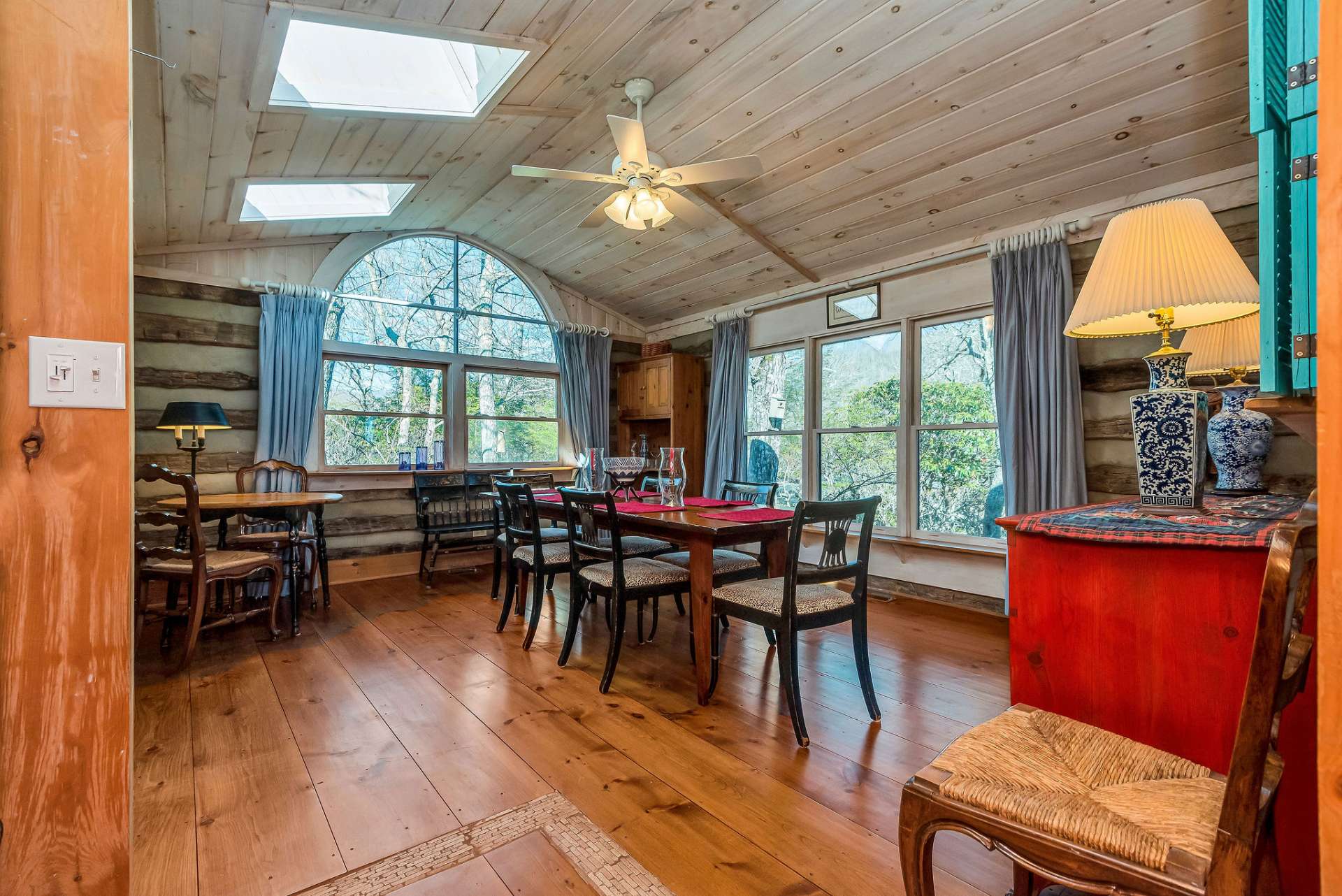 Step into a bright & cheerful family room with skylights and large windows.