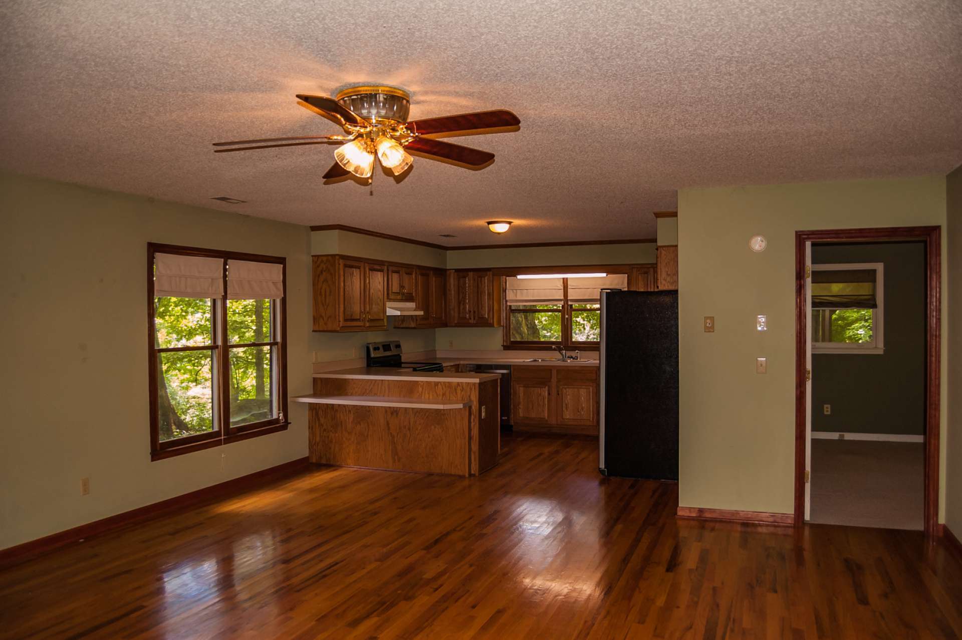 Open to the kitchen and living area, the dining area  has plenty of space for entertaining family and friends and  still cozy for an intimate dinner for two.
