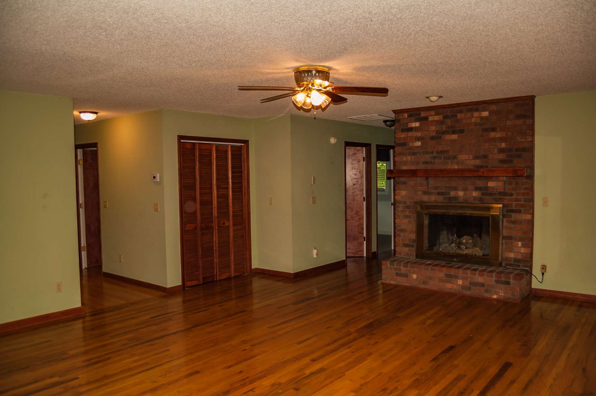 One level living offers an open floor plan with a spacious kitchen, dining and living area with hardwood floors.  The living room features a brick fireplace for added warmth on cool evenings.