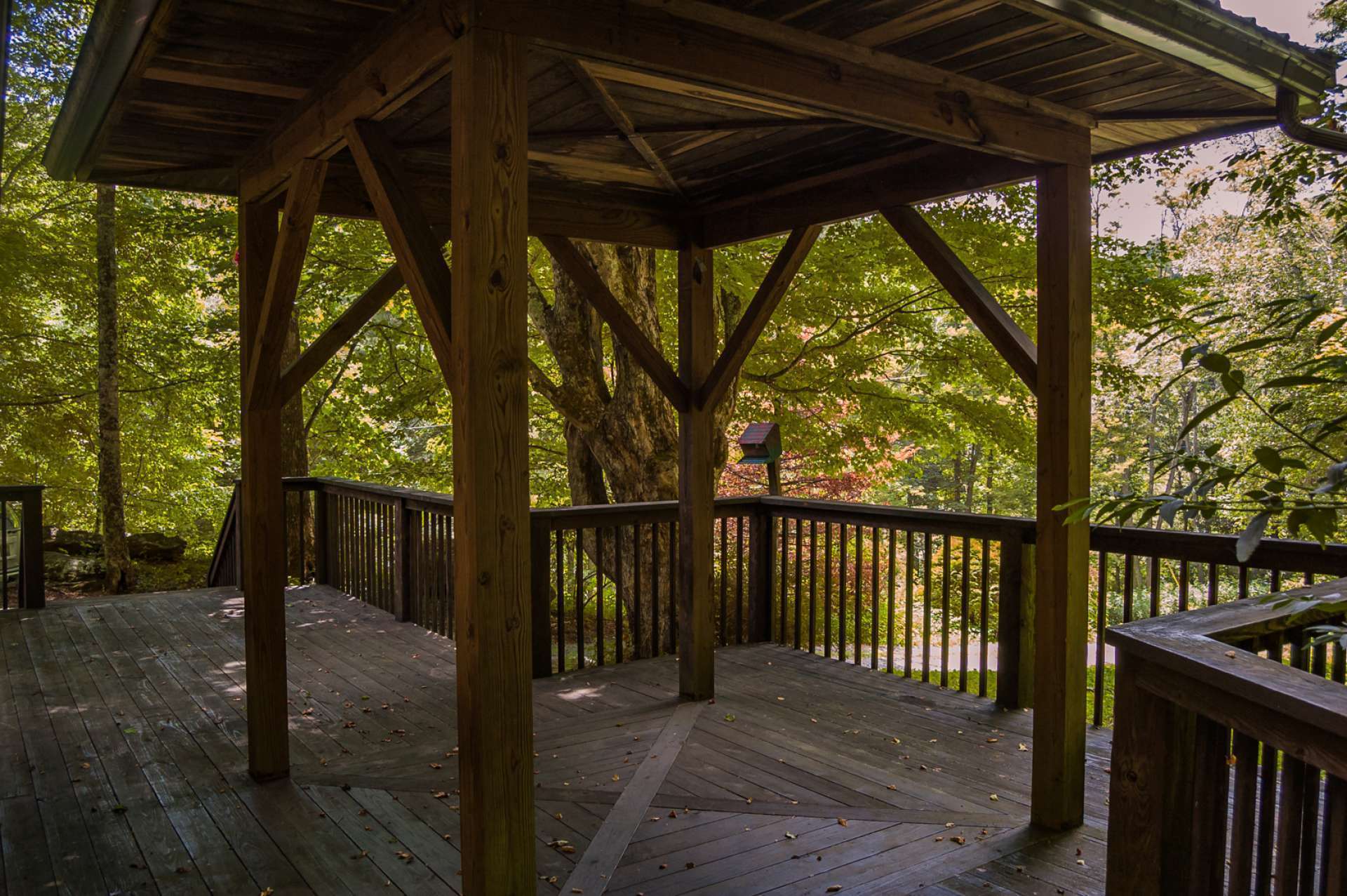 With over 2 acres, this home offers a private wooded setting with natural rock outcroppings and lots of indoor and outdoor living space. Relax on the covered deck and enjoy the sounds of Nature and fresh mountain air.