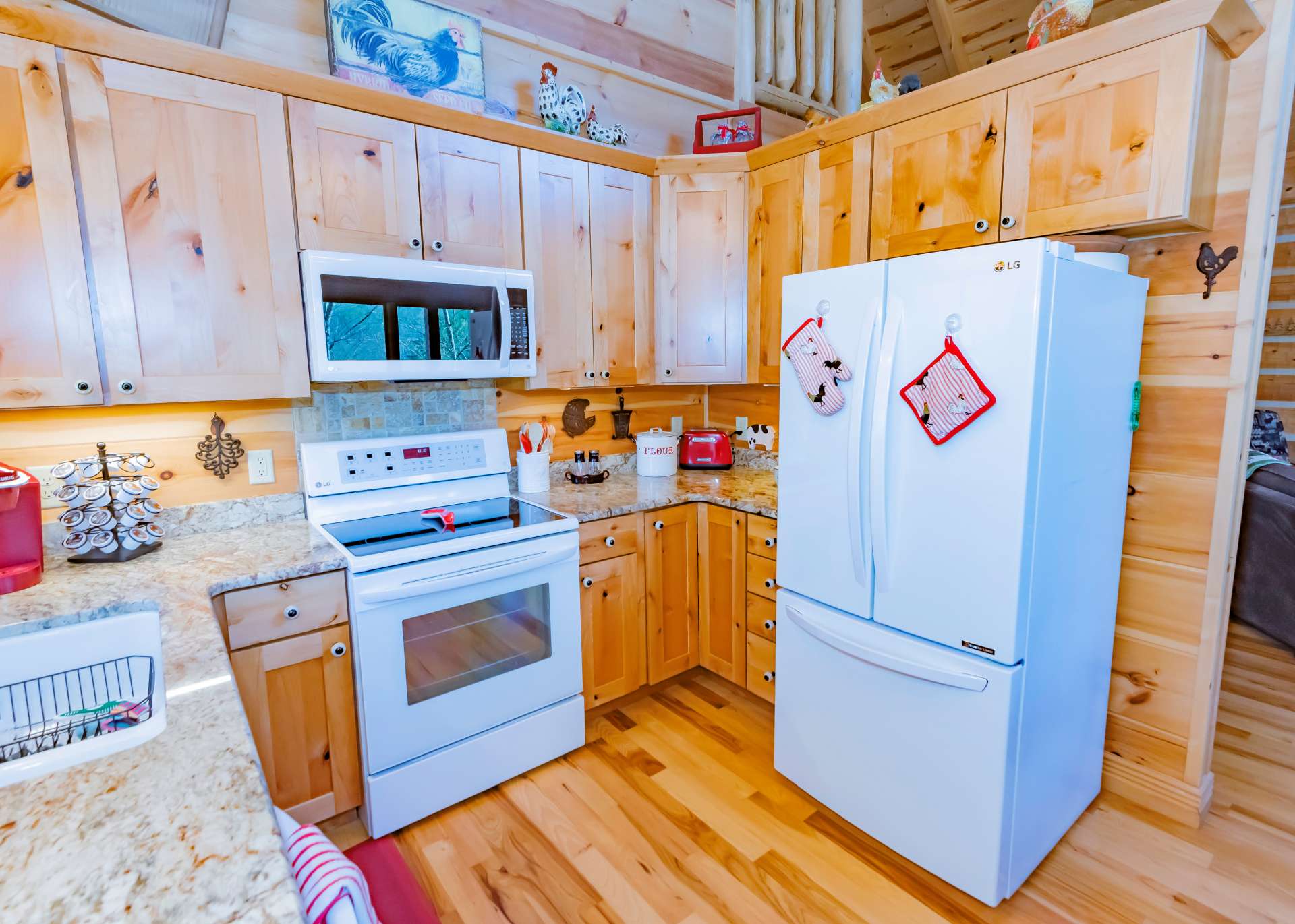 This charming kitchen offers ample work and storage space and is open to the dining area.