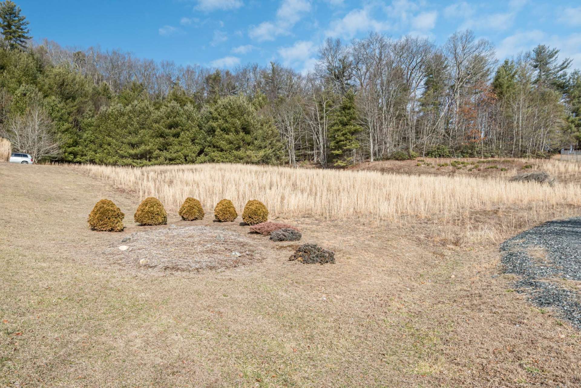 The 5.54 acre setting includes both open land and wooded acreage providing both garden and play space, and woodlands for exploring.