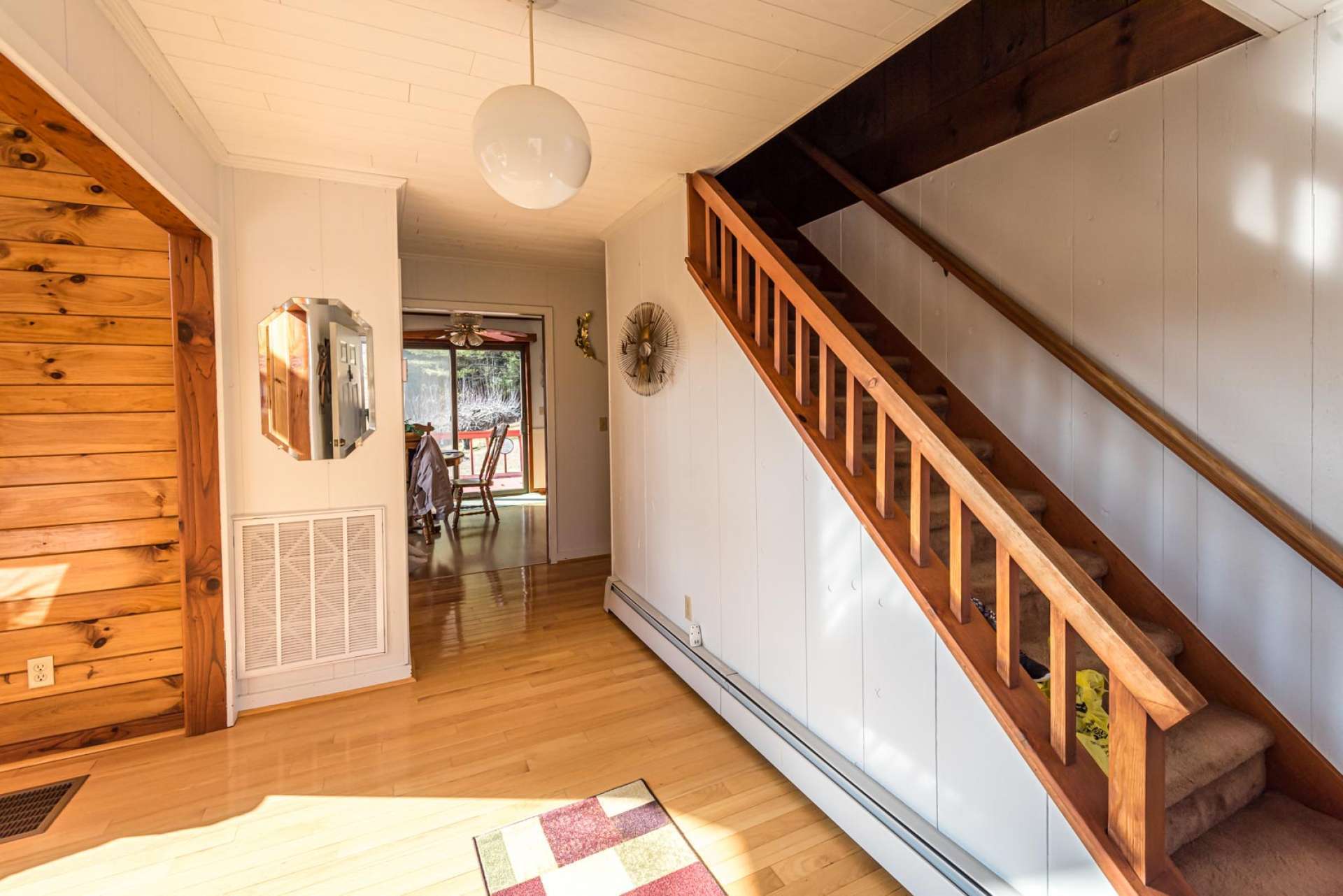 A bright and cheery foyer welcomes you and friends to come inside and explore the charm and character that radiates throughout the home.