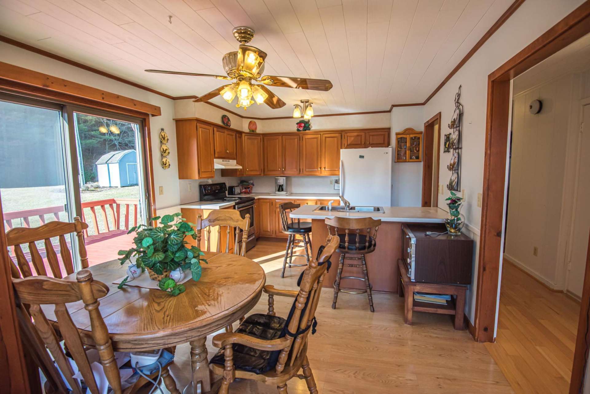 The kitchen offers plenty of work and storage space. The dining area and kitchen provides easy access to the back open deck when grilling, dining and entertaining outdoors.