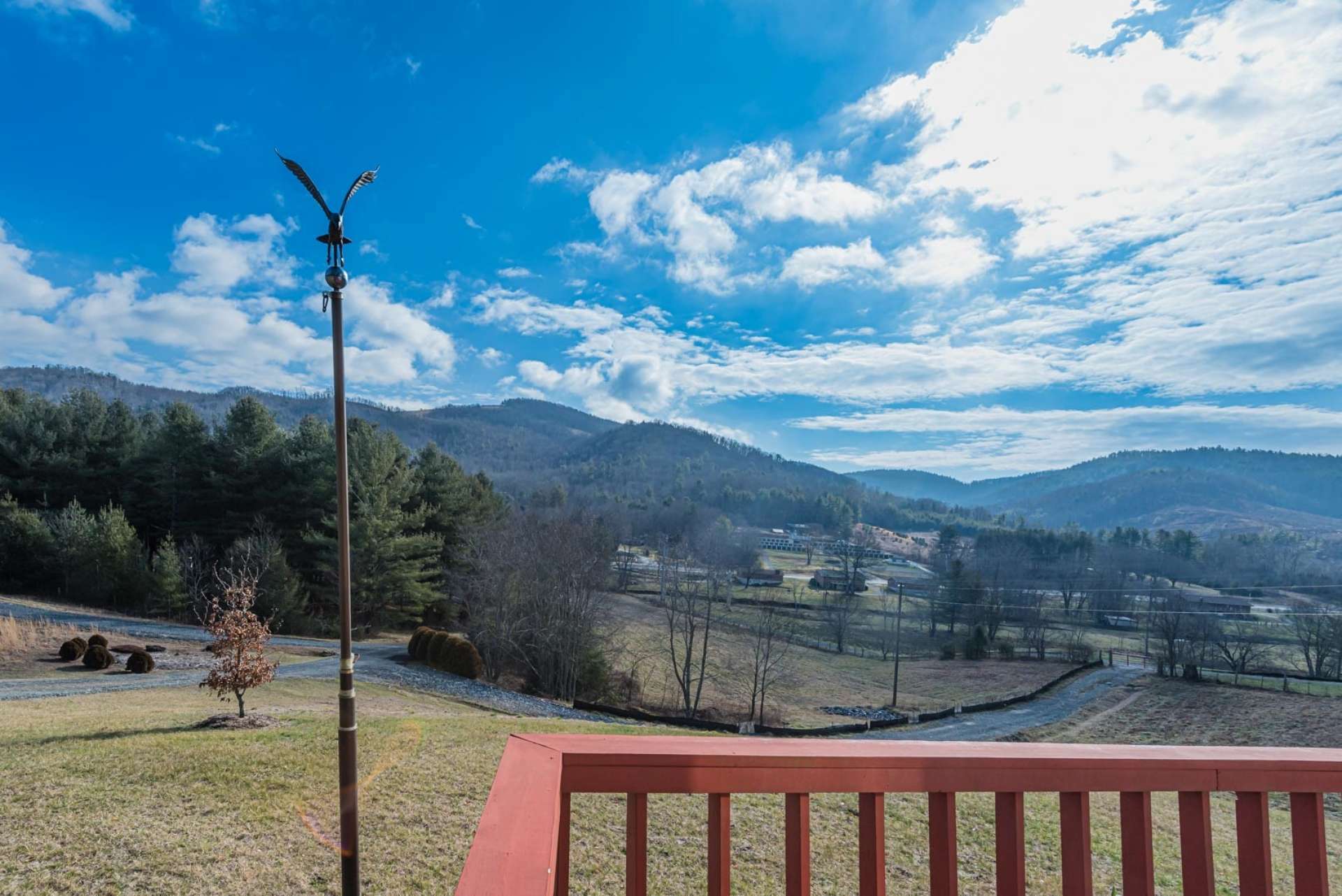 An open front deck wraps around to the side and offers a wonderful place for outdoor dining and relaxing with the views.