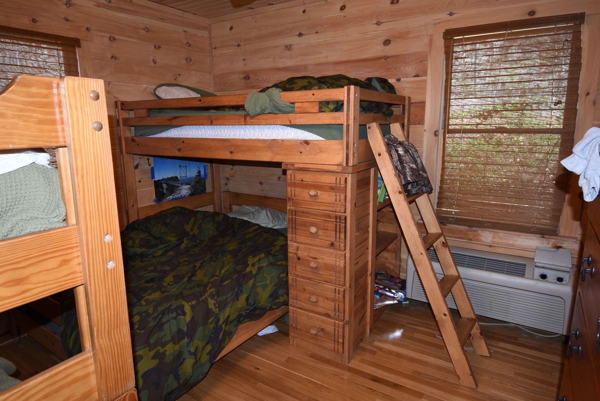 Another bedroom is amply sized with space for 2 sets of bunk beds.