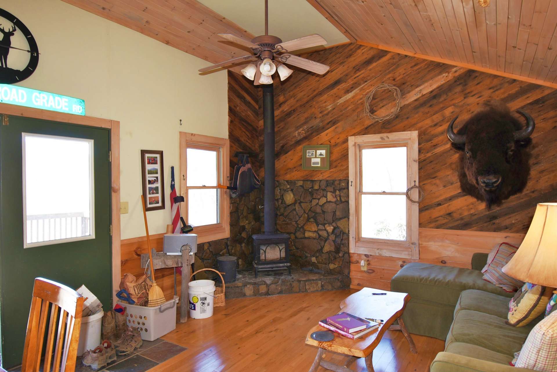 The partially vaulted living area features wood floors, and a wood burning stove for warmth on cool evenings in the NC Mountains.