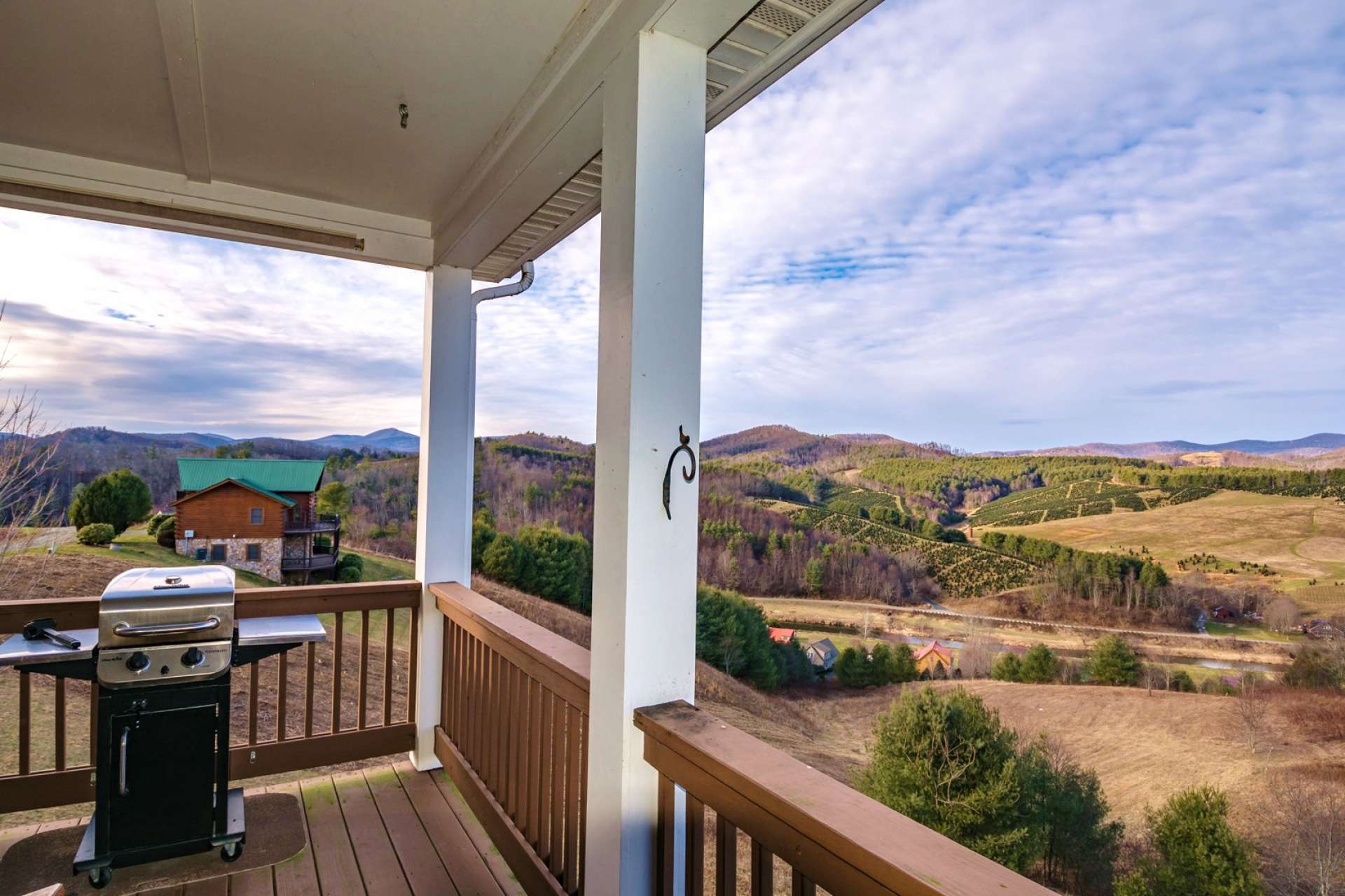 The covered back deck is an ideal location to relax with your favorite beverage and enjoy the views. Savor the majesty of the mountains and the serenity of the river as it flows through the community.
