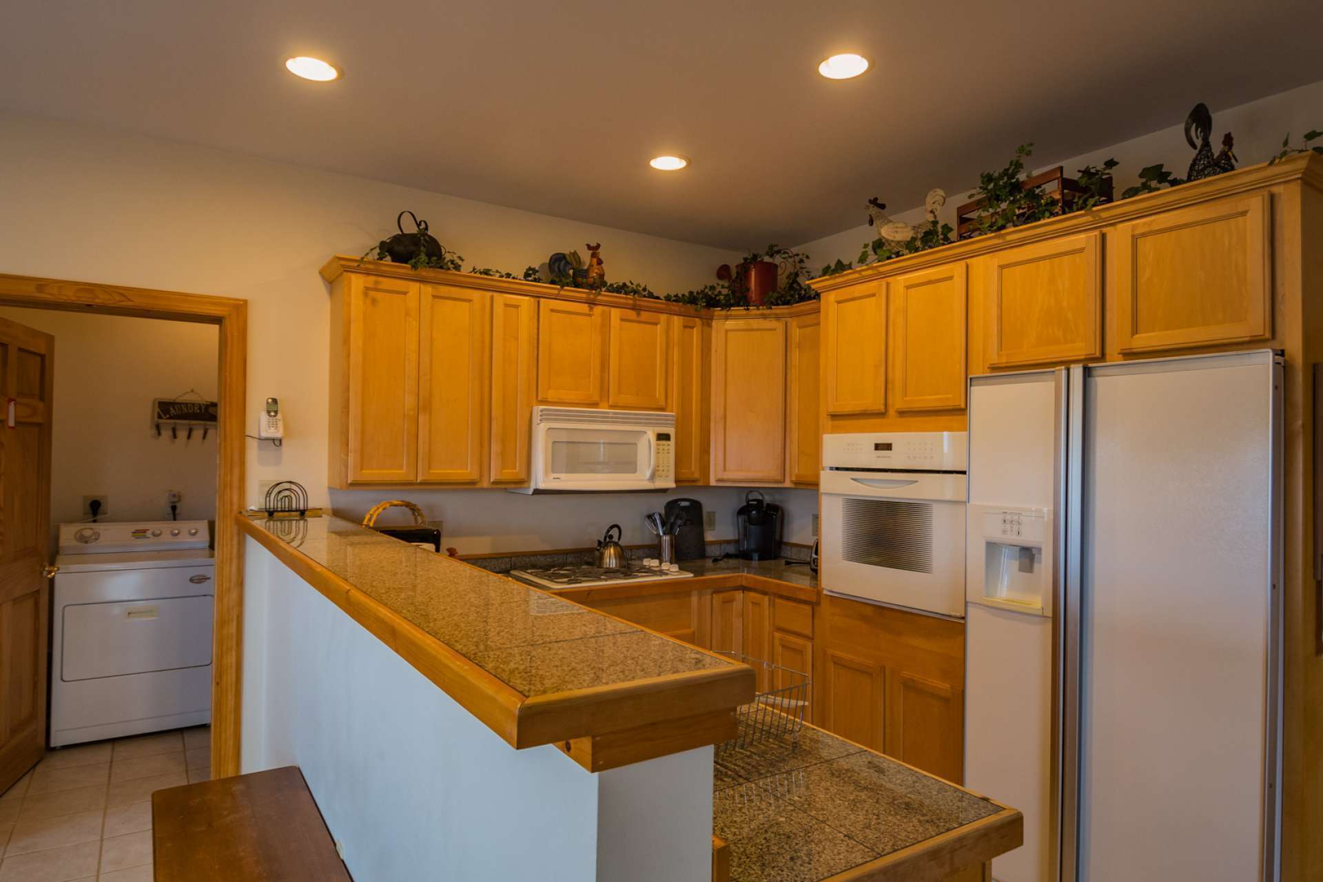 The galley-style kitchen is well equipped with plenty work and storage space.