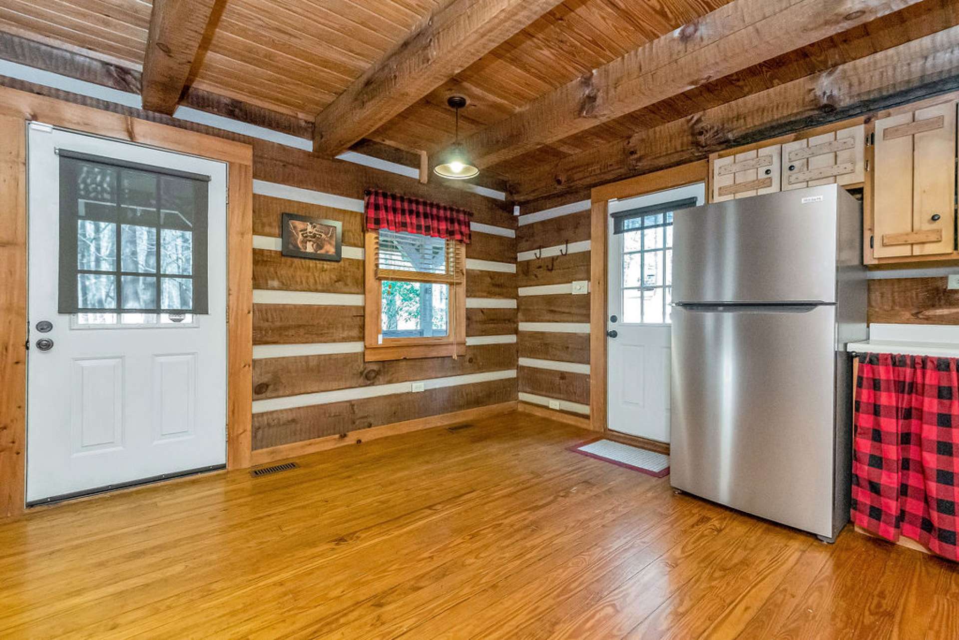 A nook by the front door offers the perfect spot for a cozy dining table.