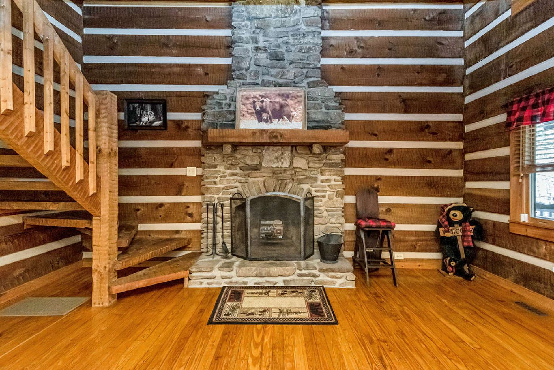 The two-story wood-burning fireplace is the focal point of the great room.