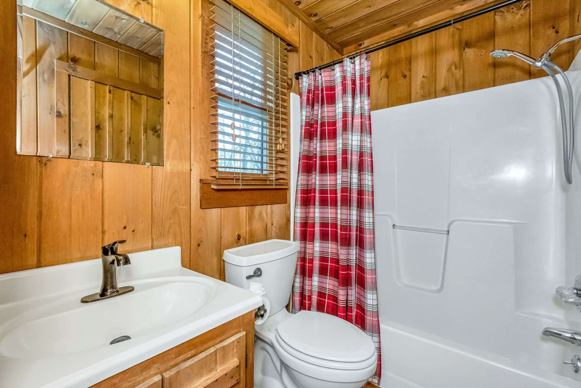 Full main level bath is located in the primary with a tub-shower combo.