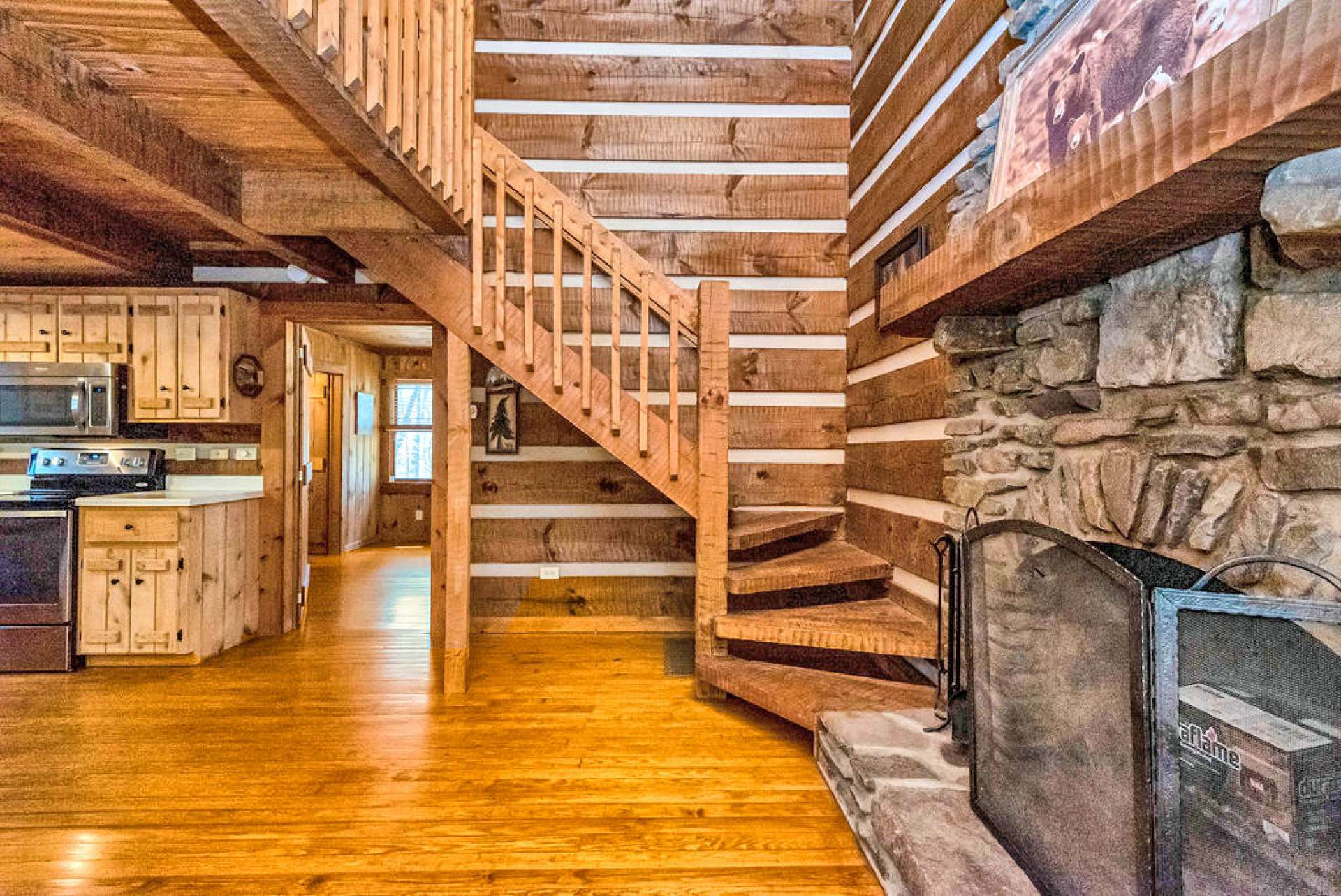 The hand-hewn stairs gracefully guide you to the loft area.