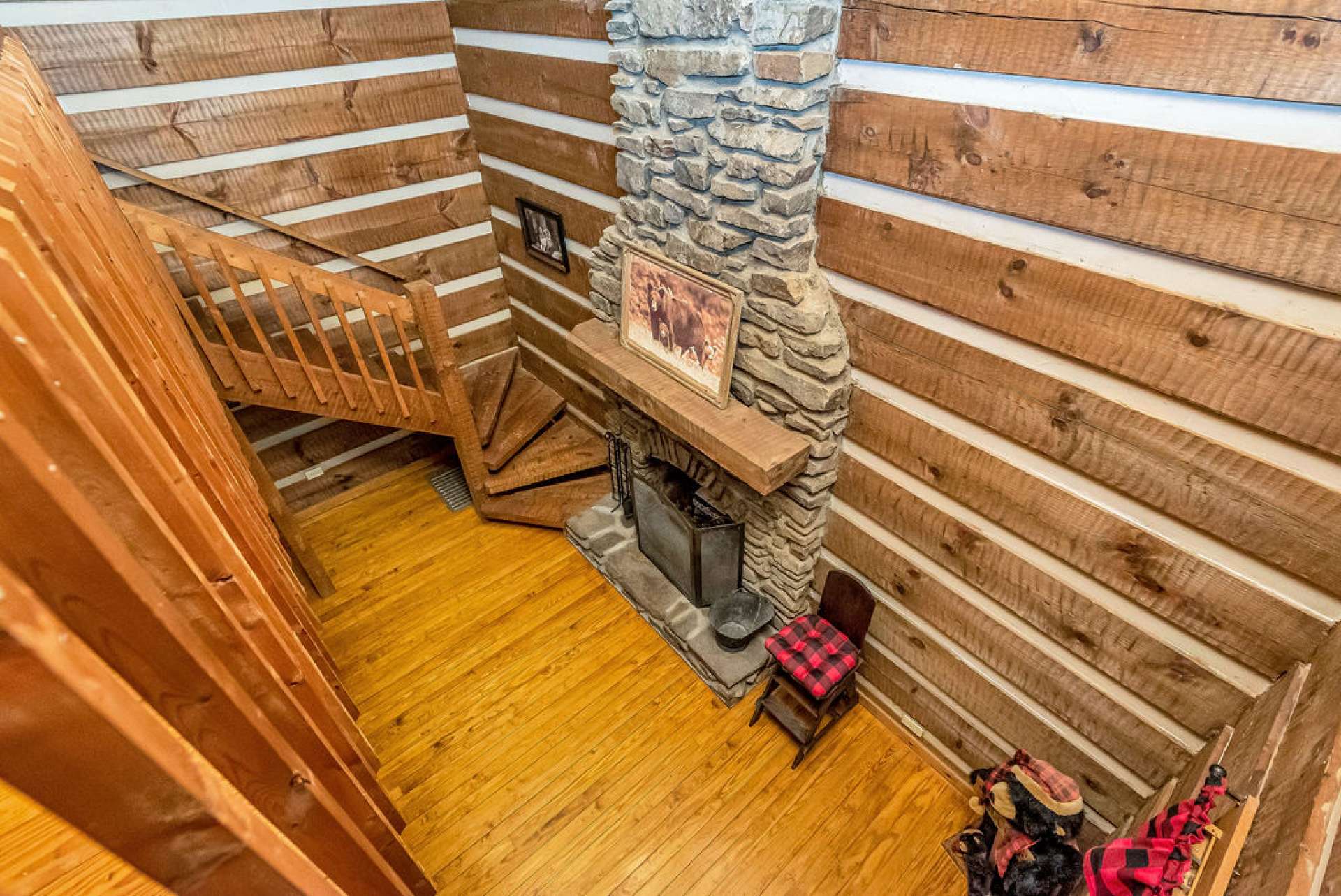 The loft area overlooks the living room below, offering a bird's-eye view of the space.