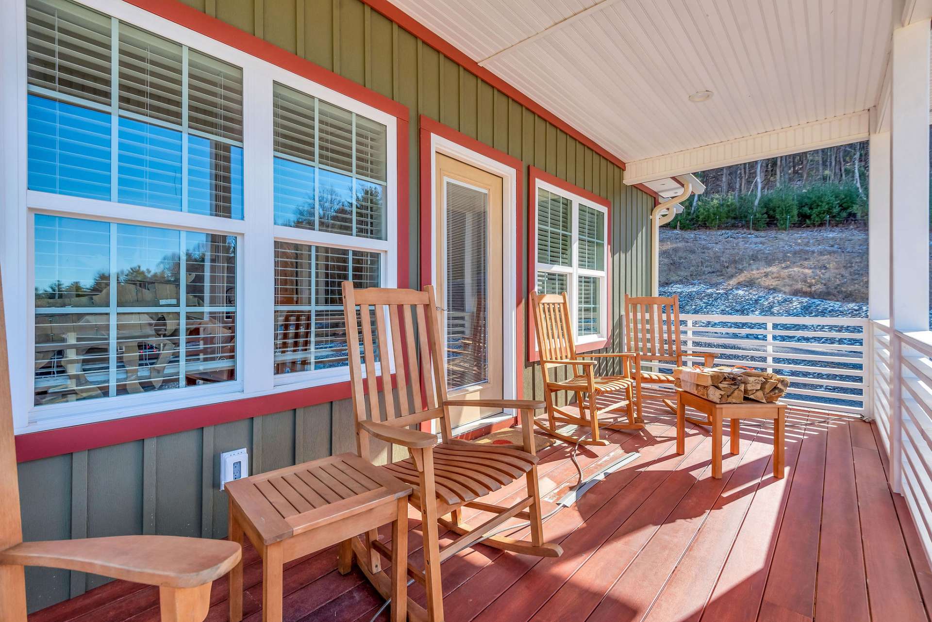 The covered porch offers additional outdoor living space in the warmer months.
