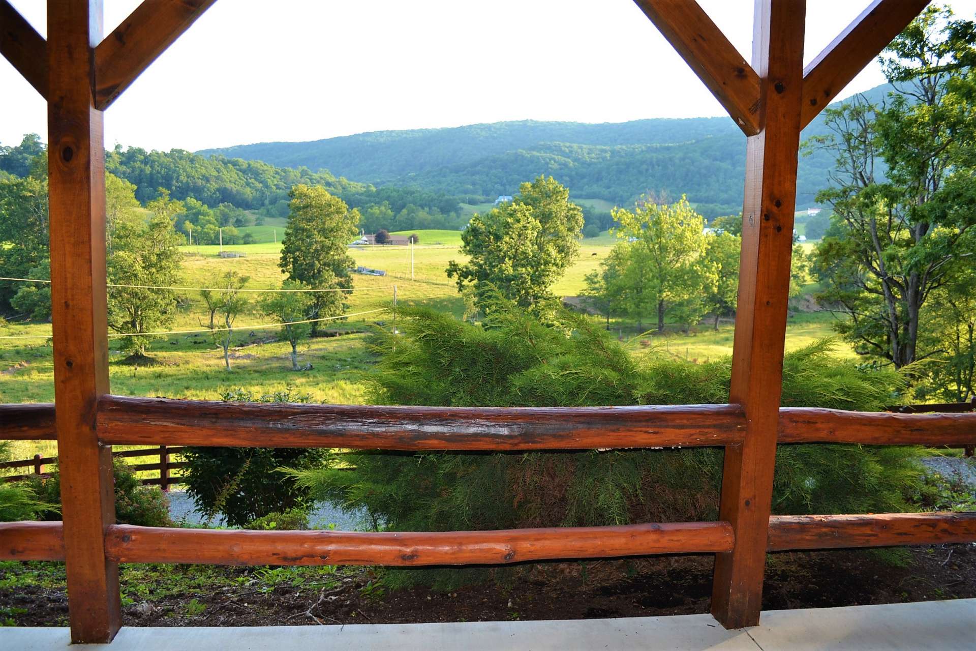 The full length covered front porch is the ideal location to enjoy a tall glass of iced tea while savoring the lush pastoral views with the Blue Ridge Mountains as a backdrop.