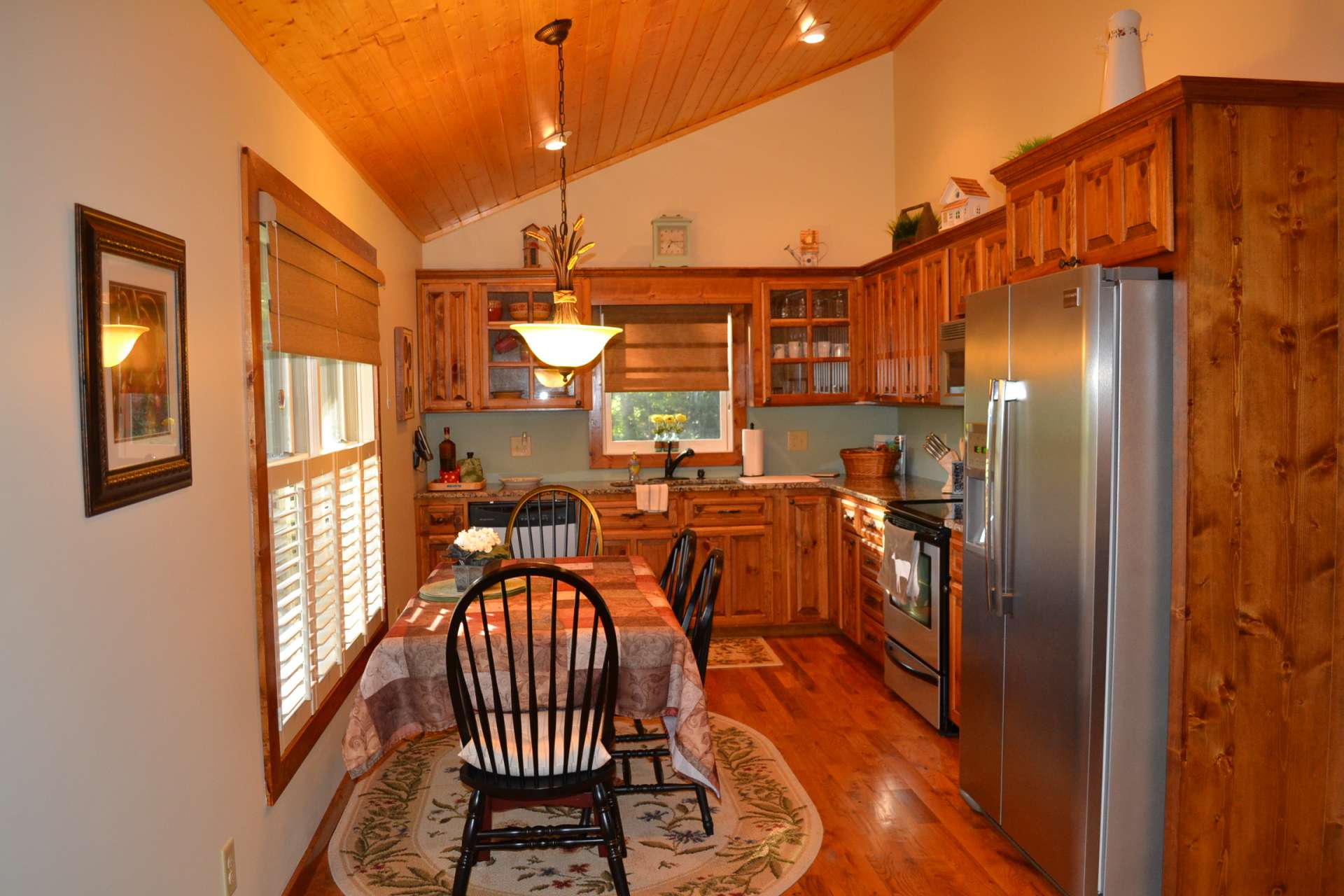 The kitchen, with granite counters & stainless appliances, is to the left as you enter from the front porch.