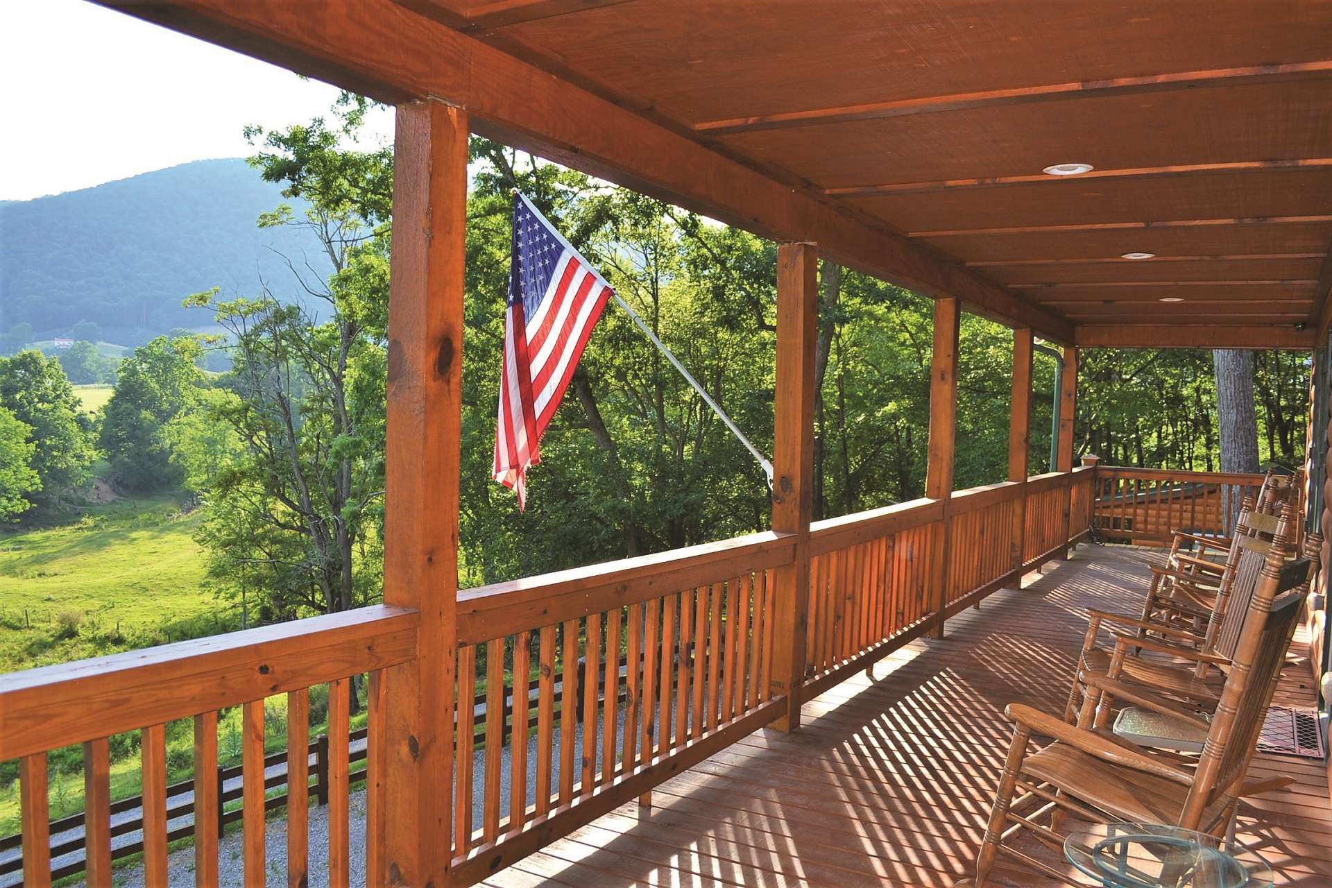 The full length covered front porch is the ideal location to enjoy a tall glass of iced tea while savoring the lush pastoral views with the Blue Ridge Mountains as a backdrop.