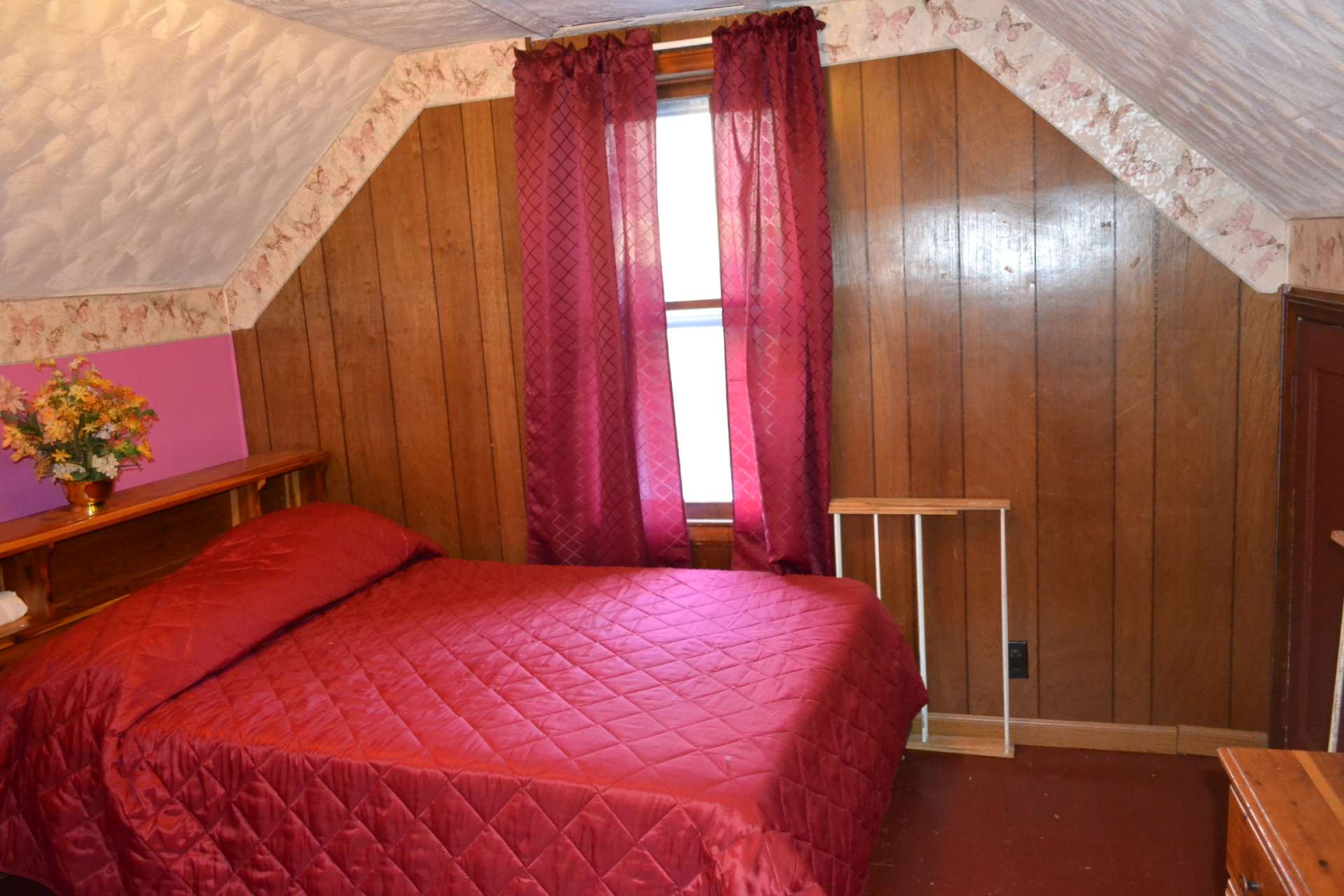 There are two charming bedrooms on the upper level.