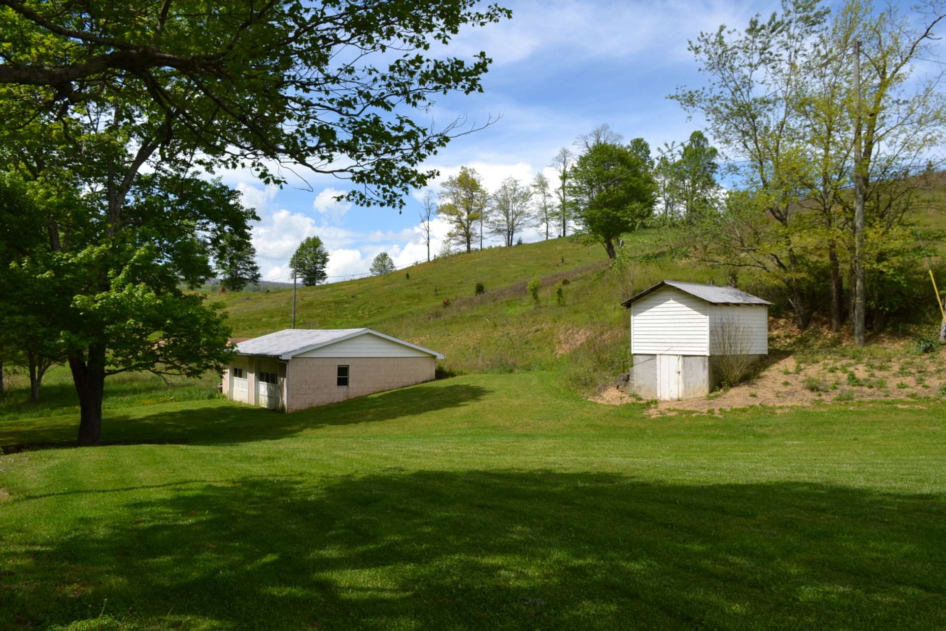 There is a 2 car detached garage/workshop, cellar, two septic systems and two wells on this property, perfect for potential extended family.