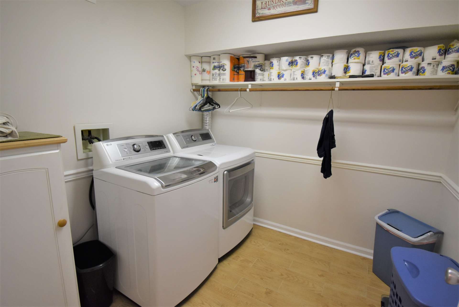 A nice sized laundry room offers additional storage space.