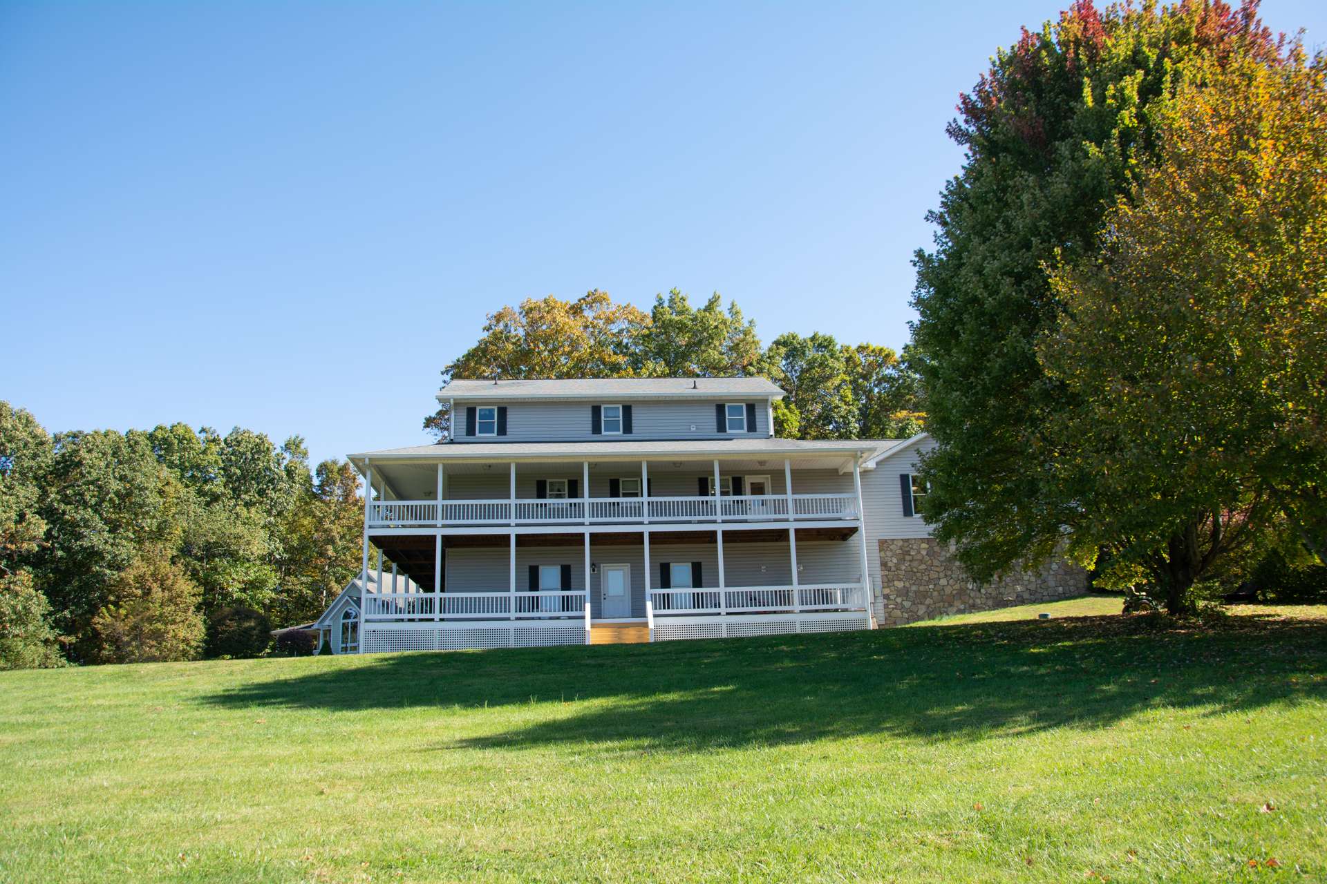 Enjoy the great outdoors on either of the wrap-around covered porches. The main level porch wraps around three sides, the lower level wraps around two sides.