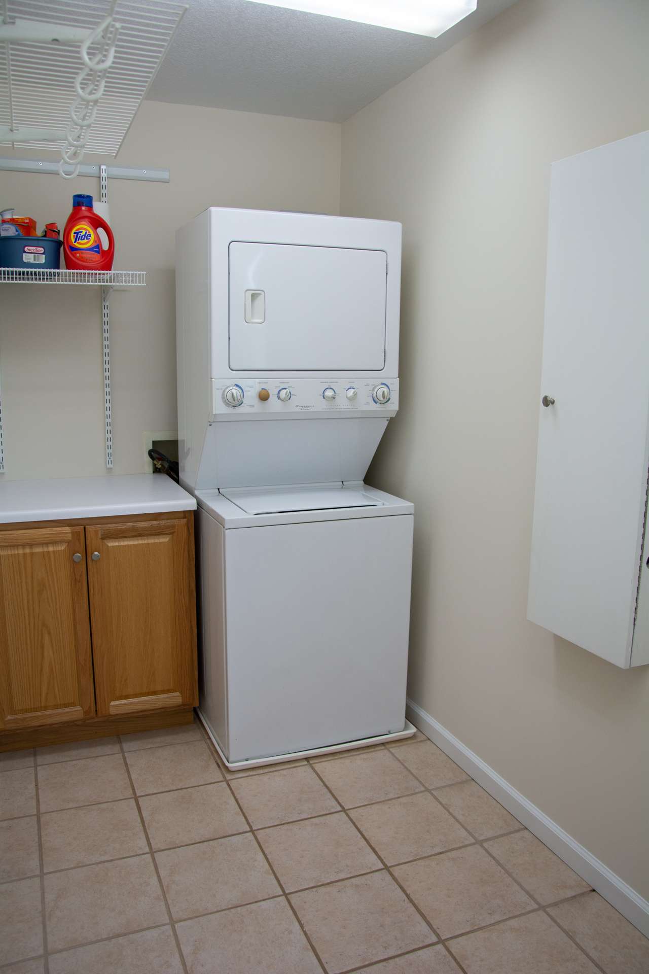 With the master and guest suites on the upper level, no need to carry laundry up & down the steps. This laundry room is upstairs as well.