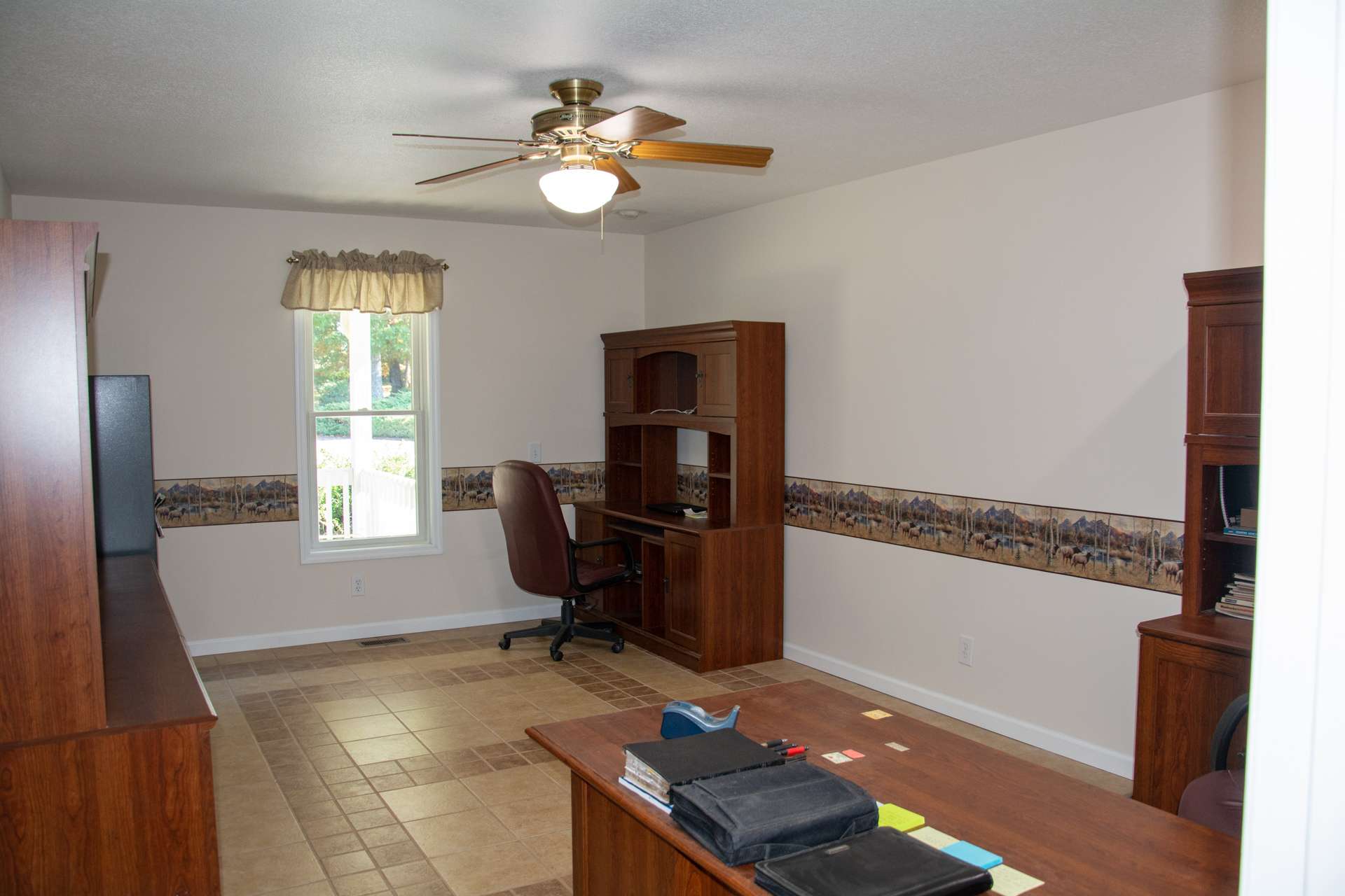 This large office/study provides enough space for multiple desks/cabinets. If you don't need a home office, use your imagination! This room is multi-functional!