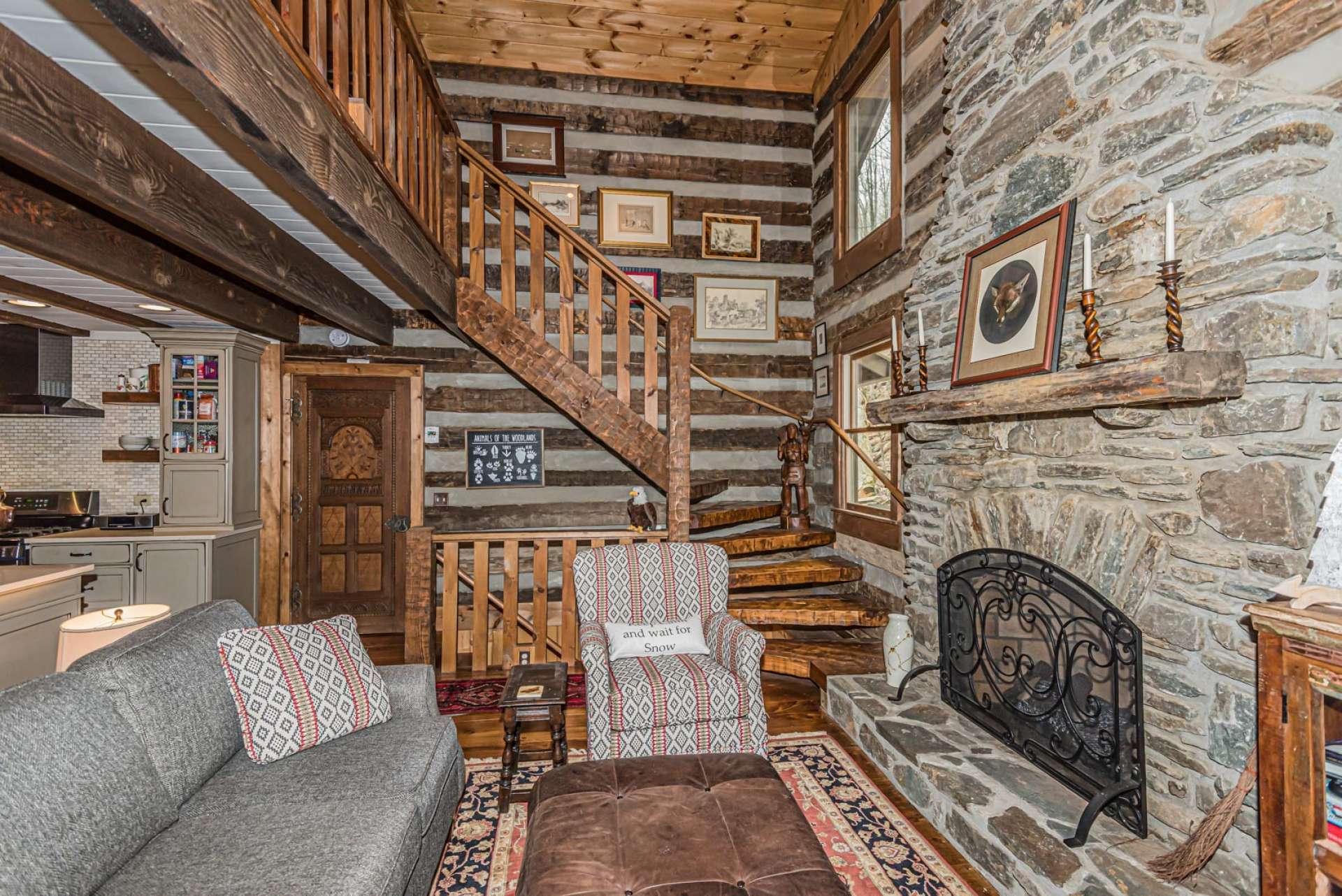 Native stone fireplace with gas logs extends to the cathedral ceiling and provides a warm glow on cool mountain evenings.