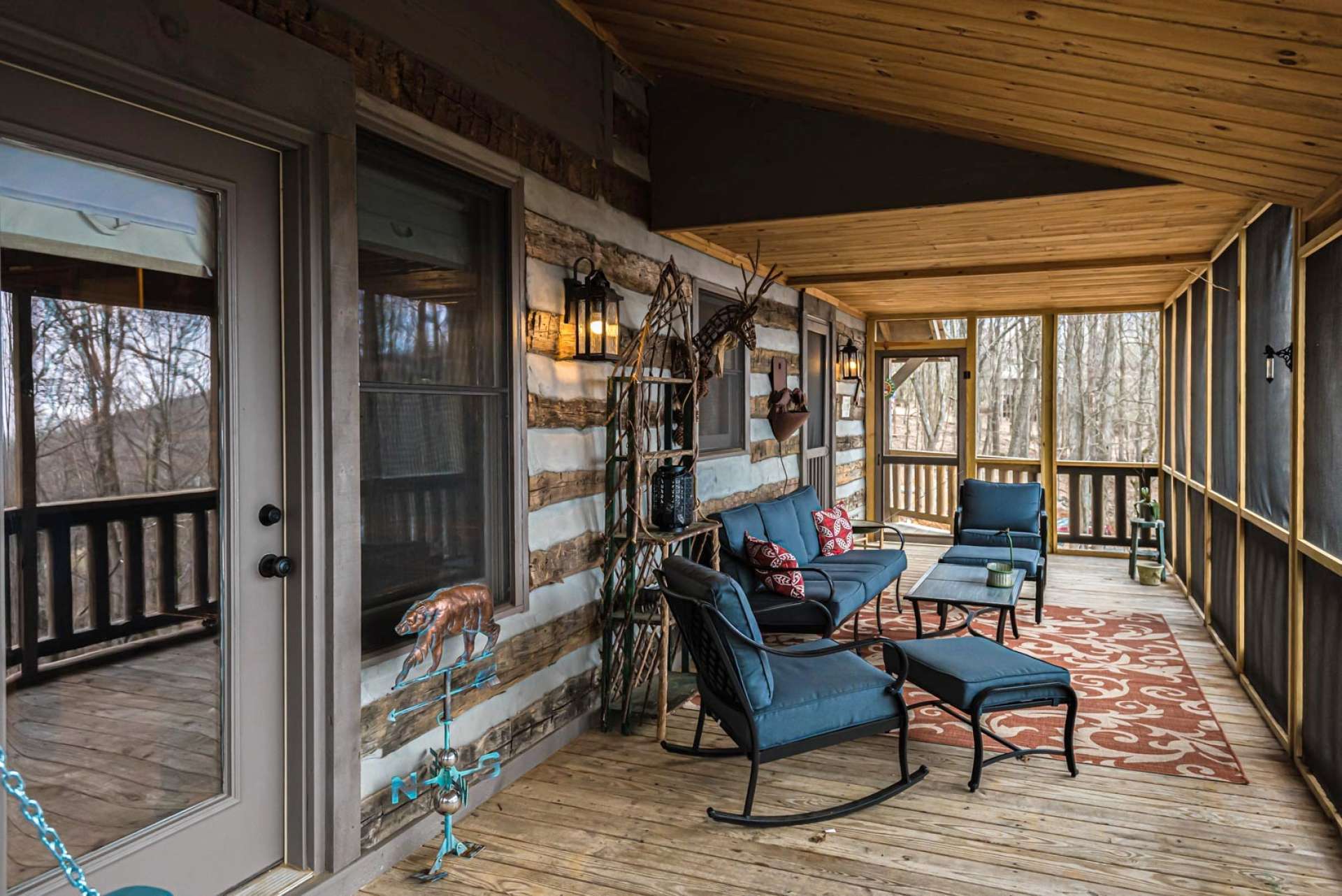 This  screened porch extends the living space during the warmer months.