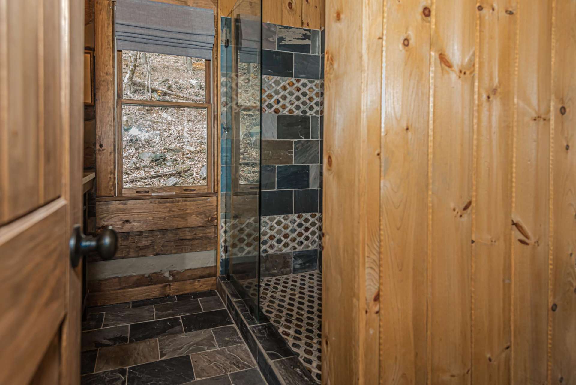 Main level master bath boasts slate flooring heated to pamper your feet.