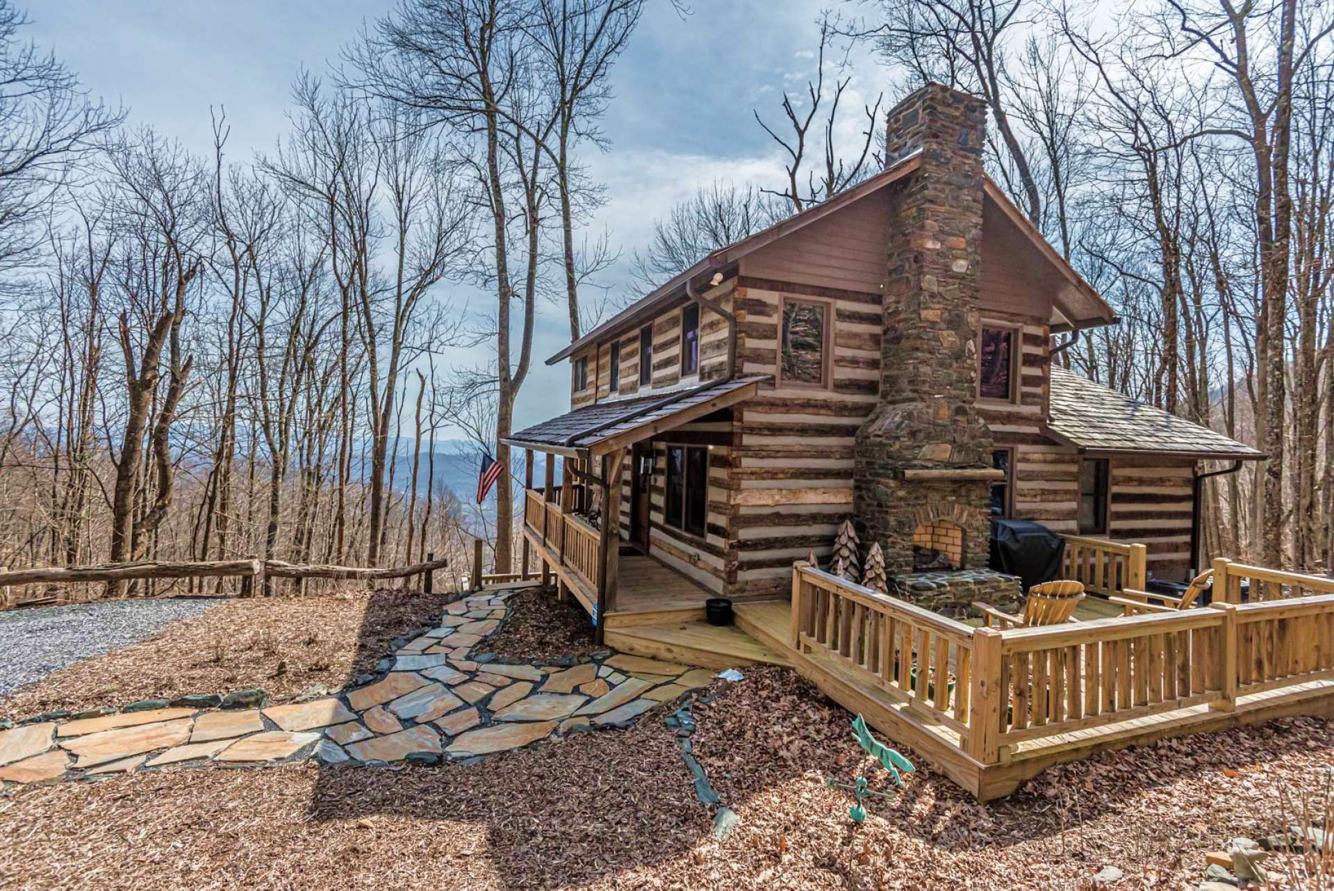 This photo shows the beauty during winter.  You can still enjoy sitting by a fire  in front of the fireplace and enjoy the views through all four seasons in the North Carolina Mountains.