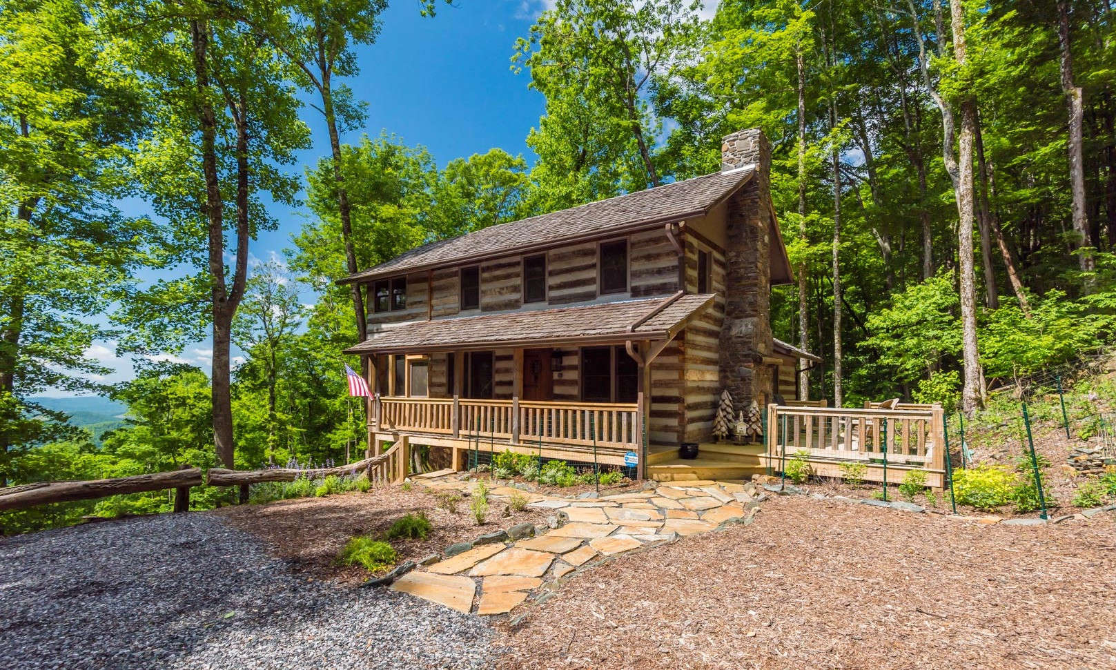 This beautifully appointed Stonebridge cabin with many upgrades, an incredible long-range view, plus end of the road privacy is nestled among a private 6.85 estate sized setting in a highly sought after log cabin community in the Todd area of Southern Ashe County.